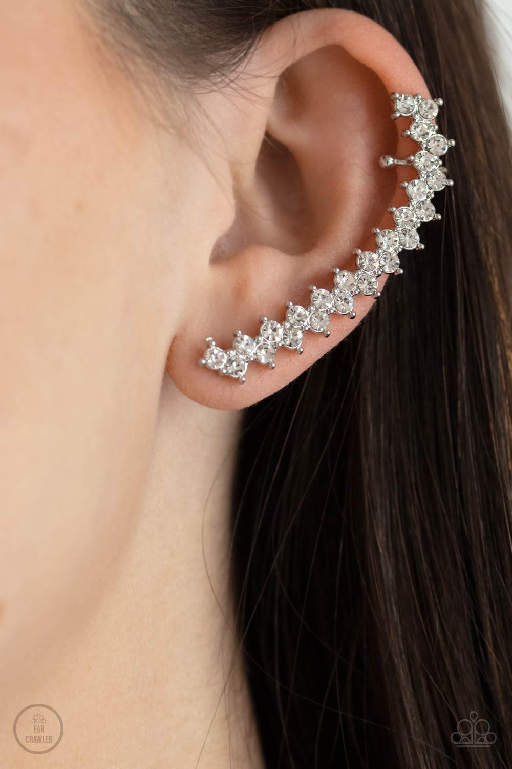 Paparazzi Accessories Let There Be LIGHTNING - White Encased in studded silver fittings, pairs of glassy white rhinestones stack into a zigzagging frame up the ear for an electrifying fashion. Features a dainty cuff attached to the top for a secure fit. S