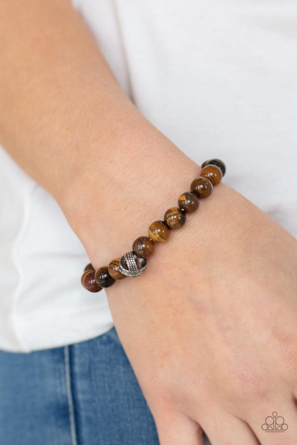 Paparazzi Accessories ZEN Commandments - Brown Infused with textured silver accents, an earthy collection of tiger's eye stones are threaded along a stretchy band around the wrist for a seasonal fashion. Sold as one individual bracelet. Jewelry