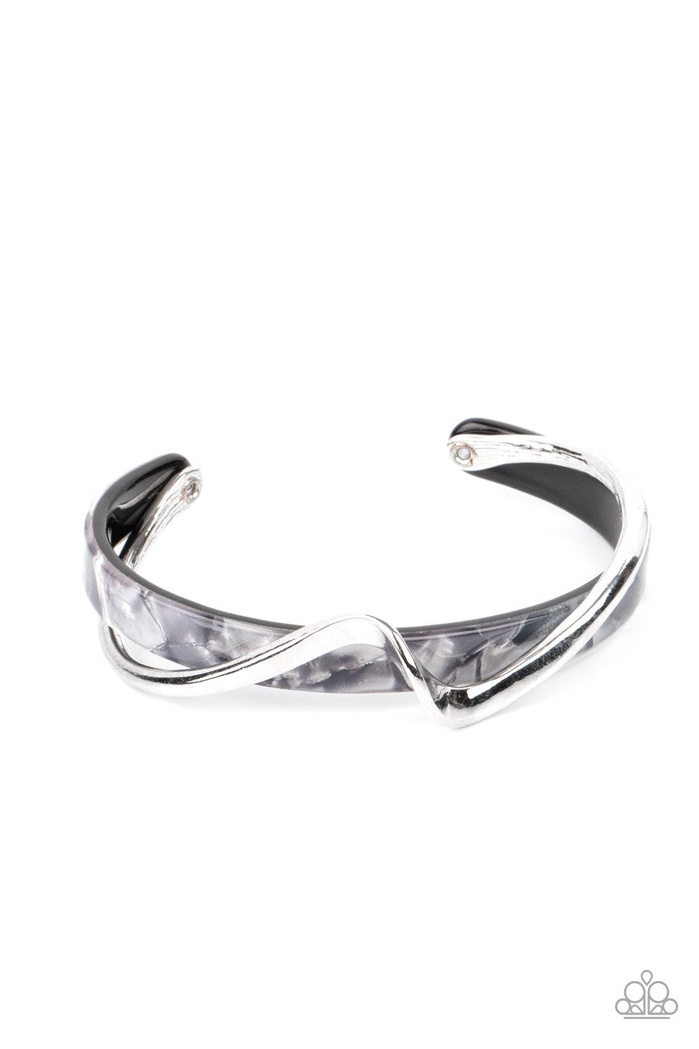 Paparazzi Accessories Craveable Curves - Silver A flat silver bar delicately curls across a dainty gray shell-like acrylic cuff, creating a whimsical centerpiece around the wrist. Sold as one individual bracelet. Jewelry