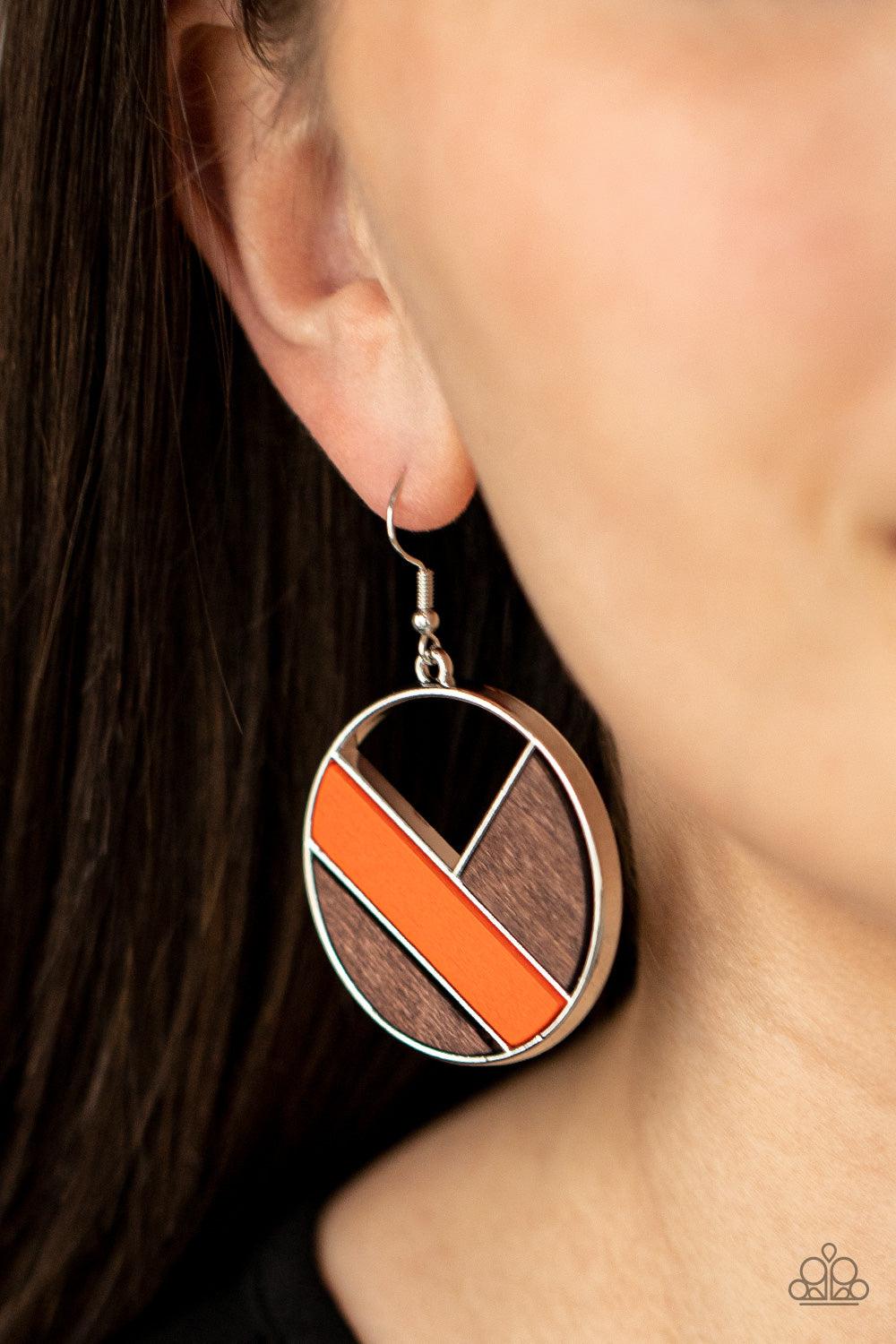 Paparazzi Accessories Dont Be MODest - Orange Featuring orange and brown finishes, geometric wooden frames piece together inside an airy silver hoop for a modern look. Earring attaches to a standard fishhook fitting. Sold as one pair of earrings. Jewelry