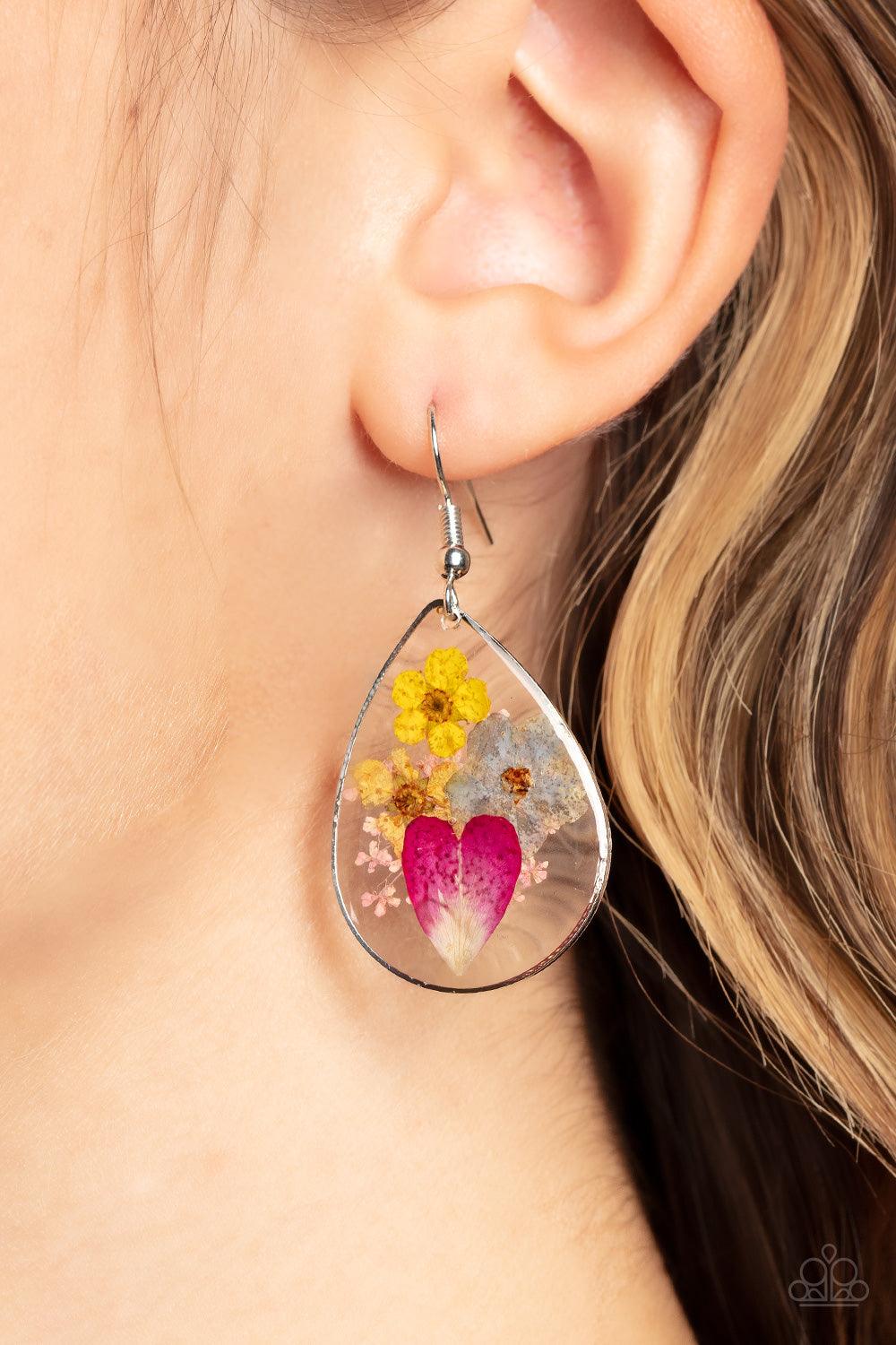 Paparazzi Accessories Prim and PRAIRIE - Multi A colorful collection of wildflowers is encased inside a glassy teardrop casing bordered in silver, creating a whimsical display. Earring attaches to a standard fishhook fitting. Sold as one pair of earrings.
