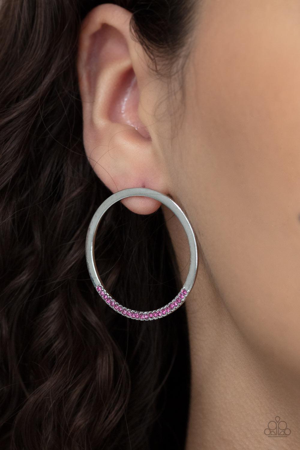 Paparazzi Accessories Spot On Opulence - Pink As if dipped in glitter, the bottom of a flat silver hoop is encrusted in dainty pink rhinestones for a classic shimmer. Earring attaches to a standard post fitting. Sold as one pair of post earrings. Jewelry