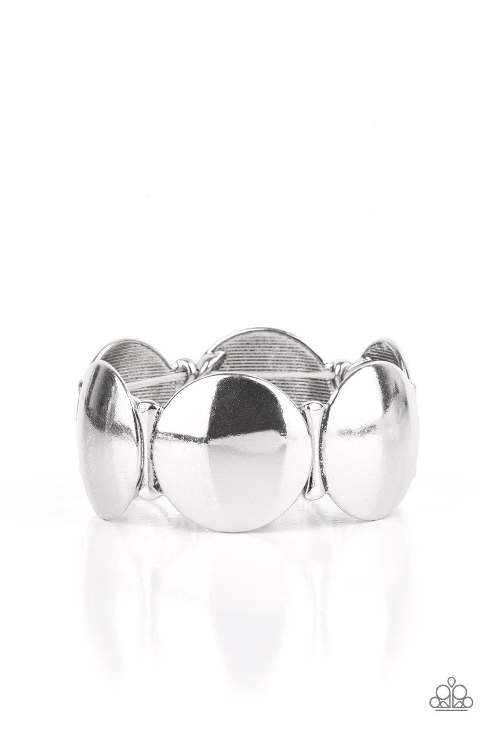 Paparazzi Accessories Going, Going, GONG! - Silver Infused with curved bar-like accents, a shiny series of beveled silver discs are threaded along stretchy bands around the wrist for a bubbly metallic look. Sold as one individual bracelet. Jewelry