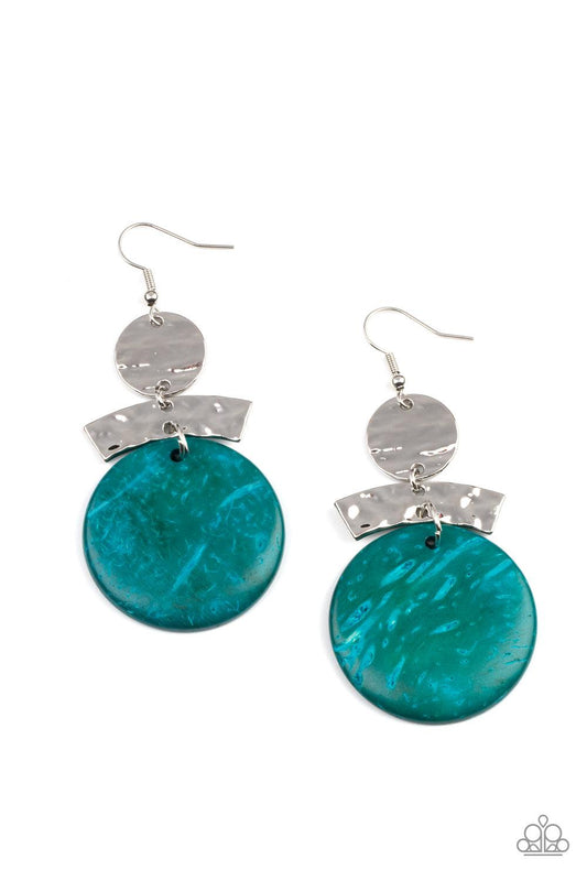 Paparazzi Accessories Diva Of My Domain - Blue Featuring a distressed blue finish, a wooden disc swings from the bottom of a hammered curved plate and hammered silver disc, coalescing into an earthy lure. Earring attaches to a standard fishhook fitting. S