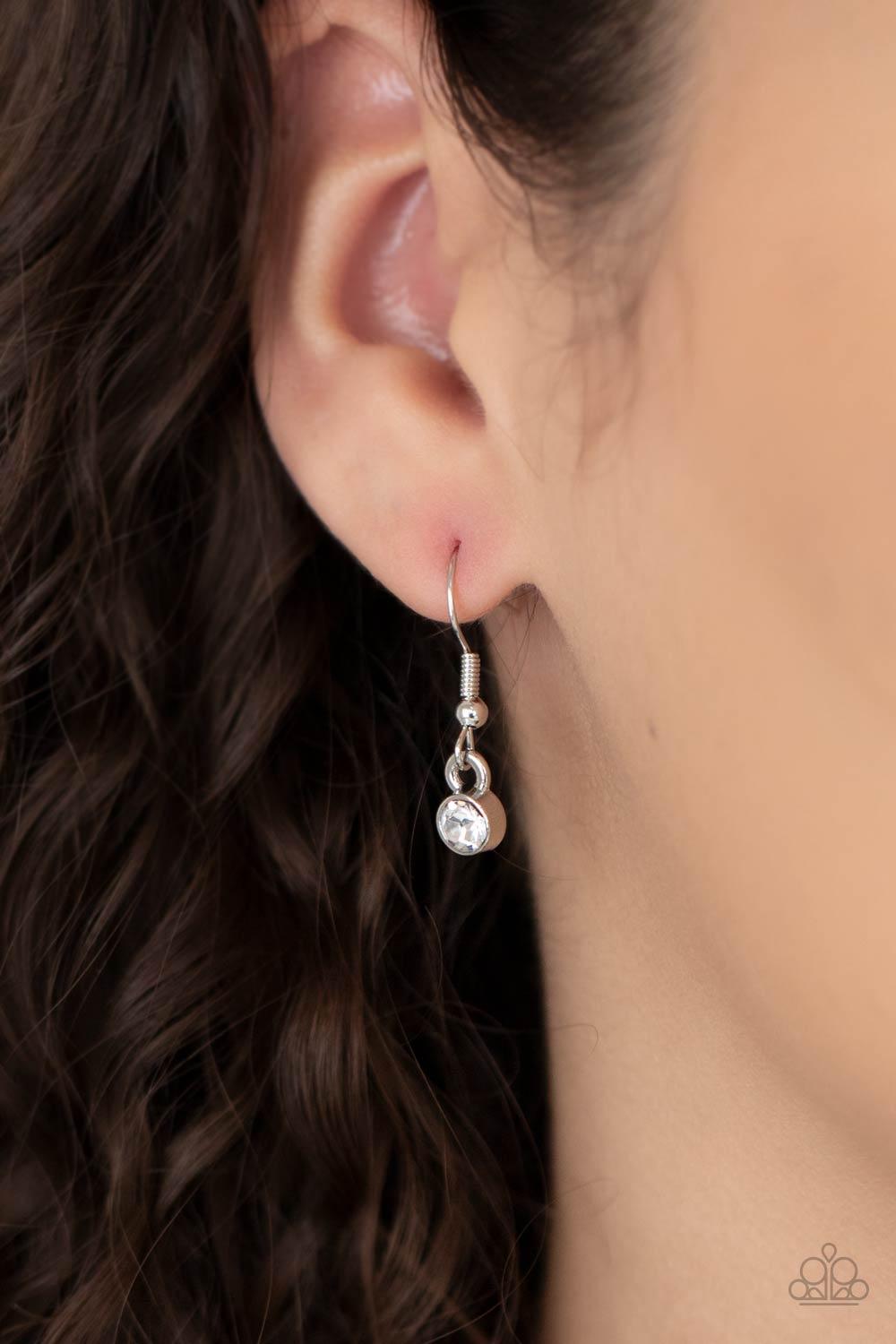 Paparazzi Accessories Fabulously Fragmented - Yellow Sporadically dotted in mismatched yellow and white rhinestones, a smattering of fragmented silver frames coalesce into a bold half moon below the collar for an edgy fashion. Features an adjustable clasp