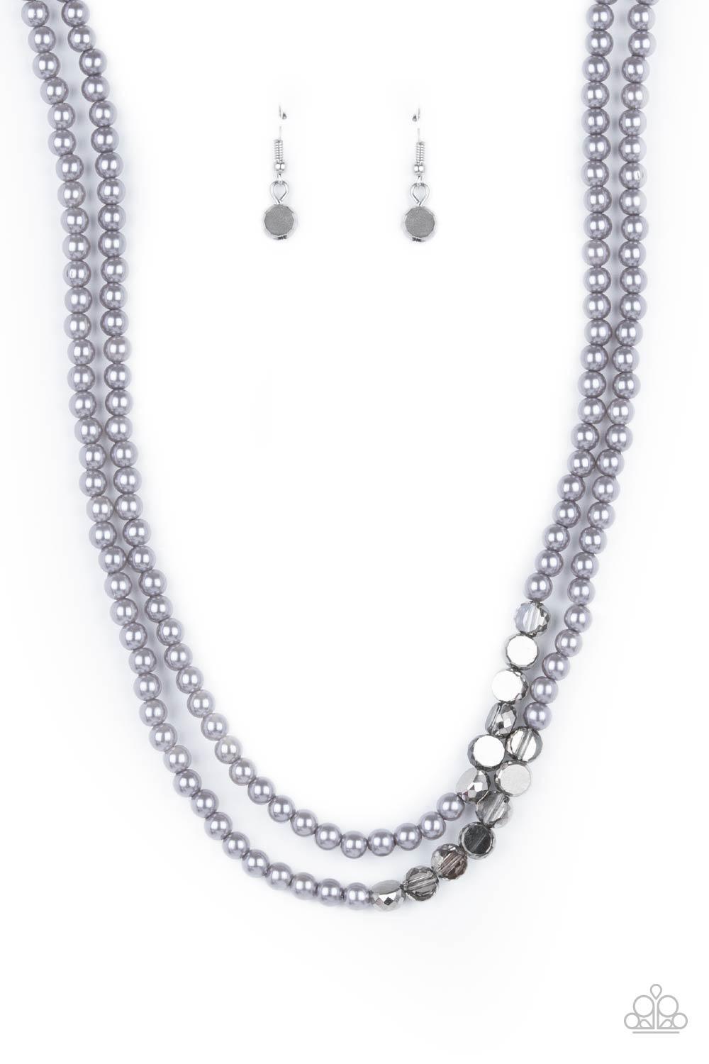 Paparazzi Accessories Poshly Petite - Silver A posh collection of pearly gray beads, accented by sections of flat, faceted metallic beads, is threaded along invisible wires, creating sophisticated layers that fall below the collar. Features an adjustable