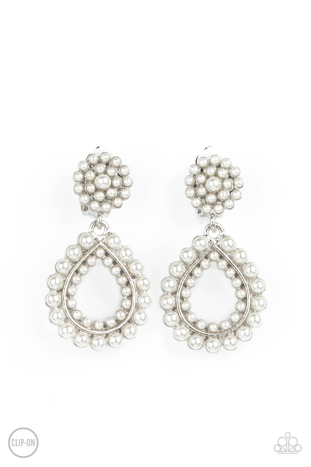 Paparazzi Accessories Discerning Droplets - White *Clip-On Droplets of pearls dot the surface of a silver teardrop frame that suspends from a round pearl encrusted disc for a classic finish. Earring attaches to a standard clip-on fitting. Sold as one pair