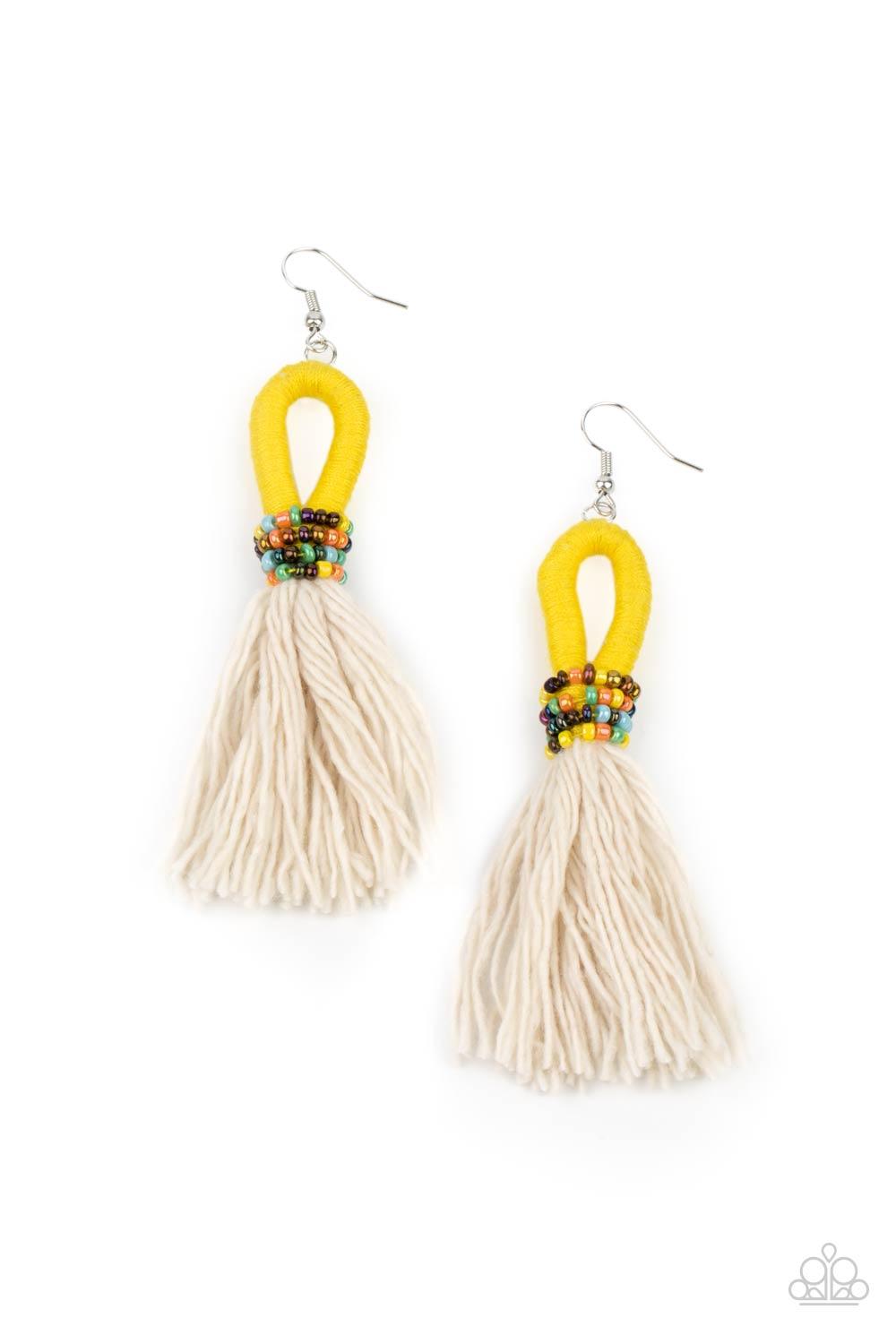 Paparazzi Accessories The Dustup - Yellow A tassel of soft white cotton fans out under rows of brightly colored seed beads. Anchored by a loop of vibrant yellow floss, the eye-catching style swings from the ear for a show-stopping statement. Earring attac