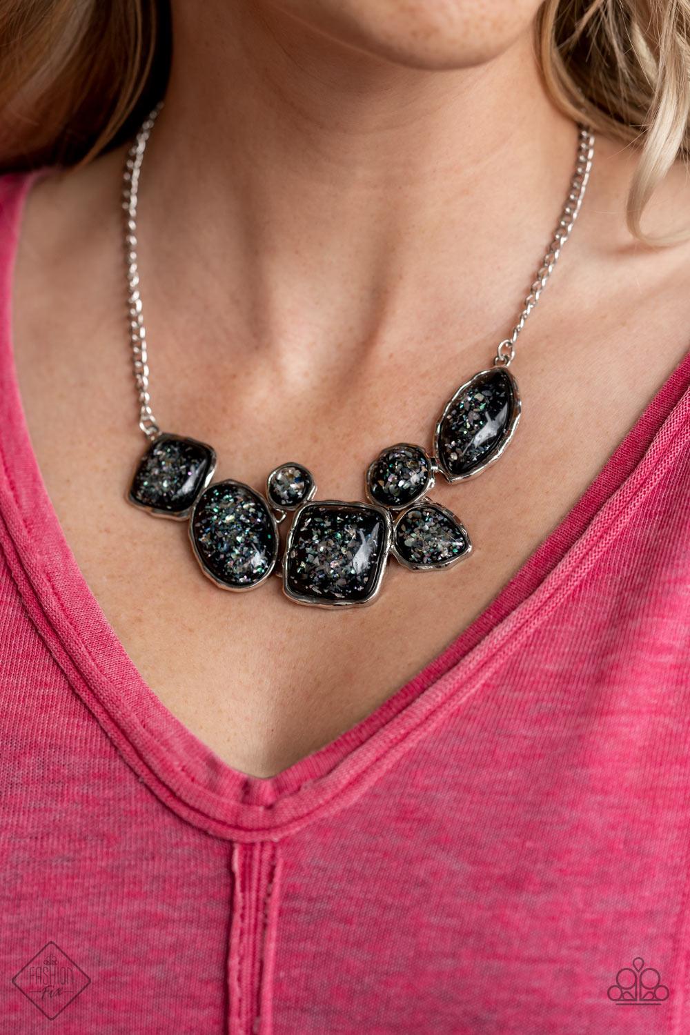Paparazzi Accessories So Jelly - Black Flecks of iridescent shell-like pieces are encased in glassy black beads. Featuring hammered silver frames, the mismatched frames delicately cluster below the collar for a bubbly ethereal fashion. Features an adjusta