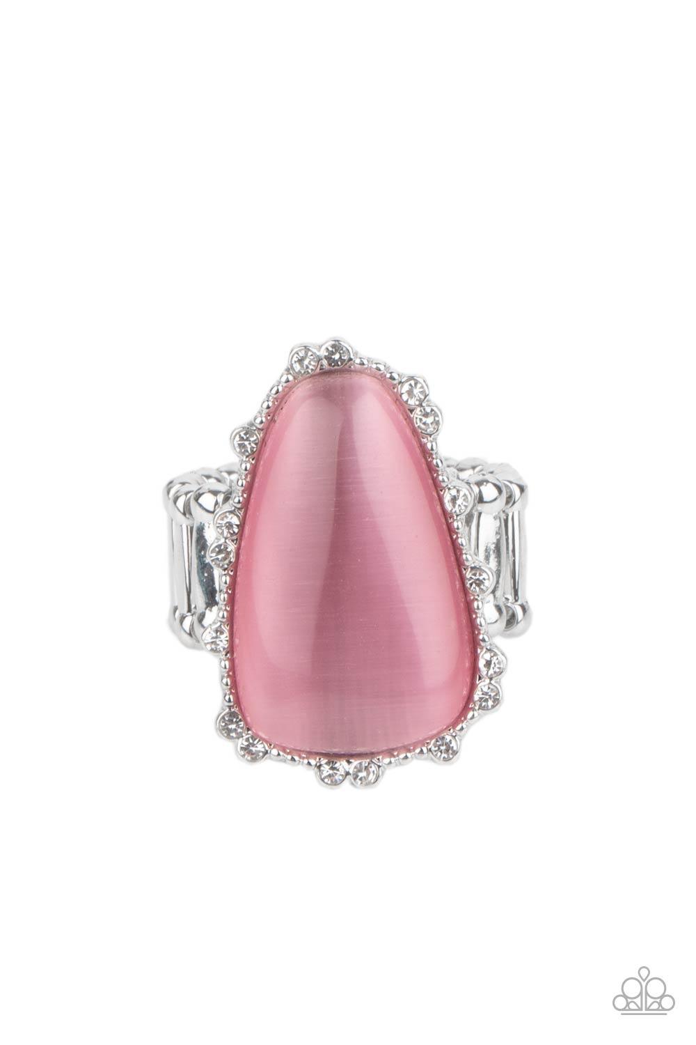 Paparazzi Accessories Newport Nouveau - Pink A tranquil asymmetrical pink cat's eye stone is encased in a delicately dotted shimmery silver frame. Dainty sparkly white rhinestones surround the oversized stone creating an elegant centerpiece atop the finge