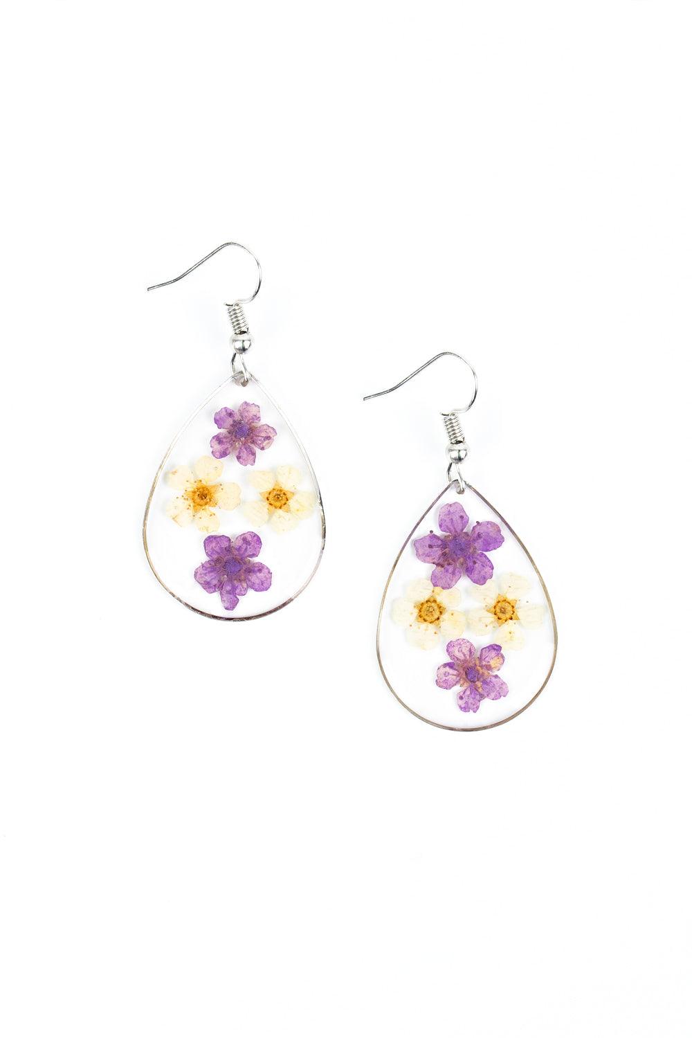 Paparazzi Accessories Perennial Prairie - Multi Dainty yellow and purple flowers are encased in a glassy teardrop, creating a whimsical frame. Earring attaches to a standard fishhook fitting. Sold as one pair of earrings. Jewelry