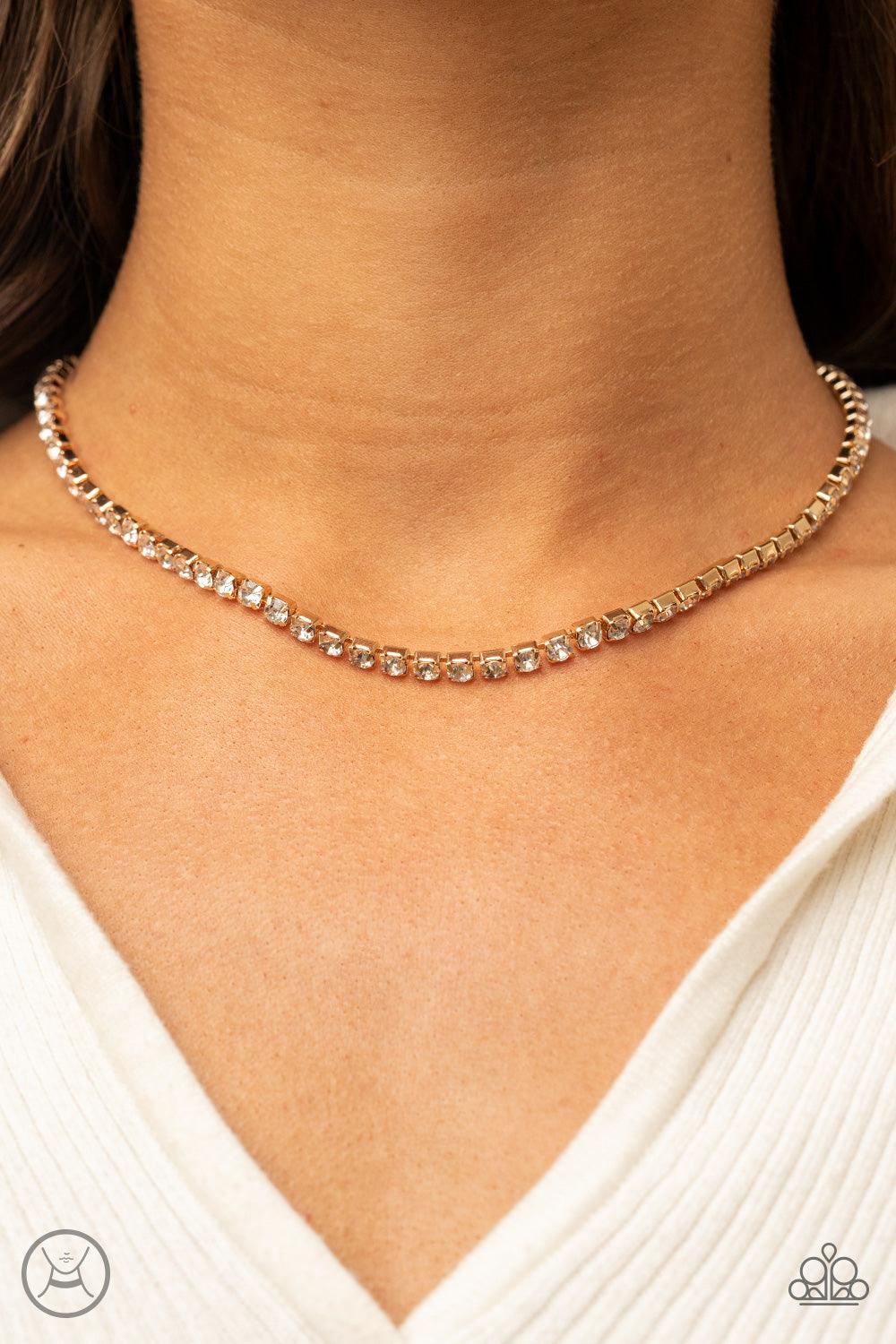Paparazzi Accessories Starlight Radiance - Gold A strand of brilliant white rhinestones set in classic gold fittings creates a stunningly radiant display across the collar. Features an adjustable clasp closure. Sold as one individual choker necklace. Incl