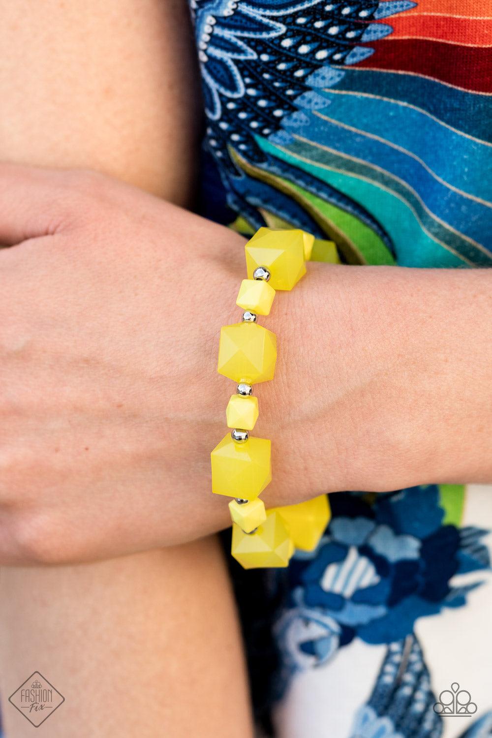 Paparazzi Accessories Trendsetting Tourist - Yellow Varying in size, a faceted collection of solid and opaque Illuminating cube beads alternate with dainty silver beads to decorate a stretchy band that wraps around the wrist for a glamorous pop of geometr