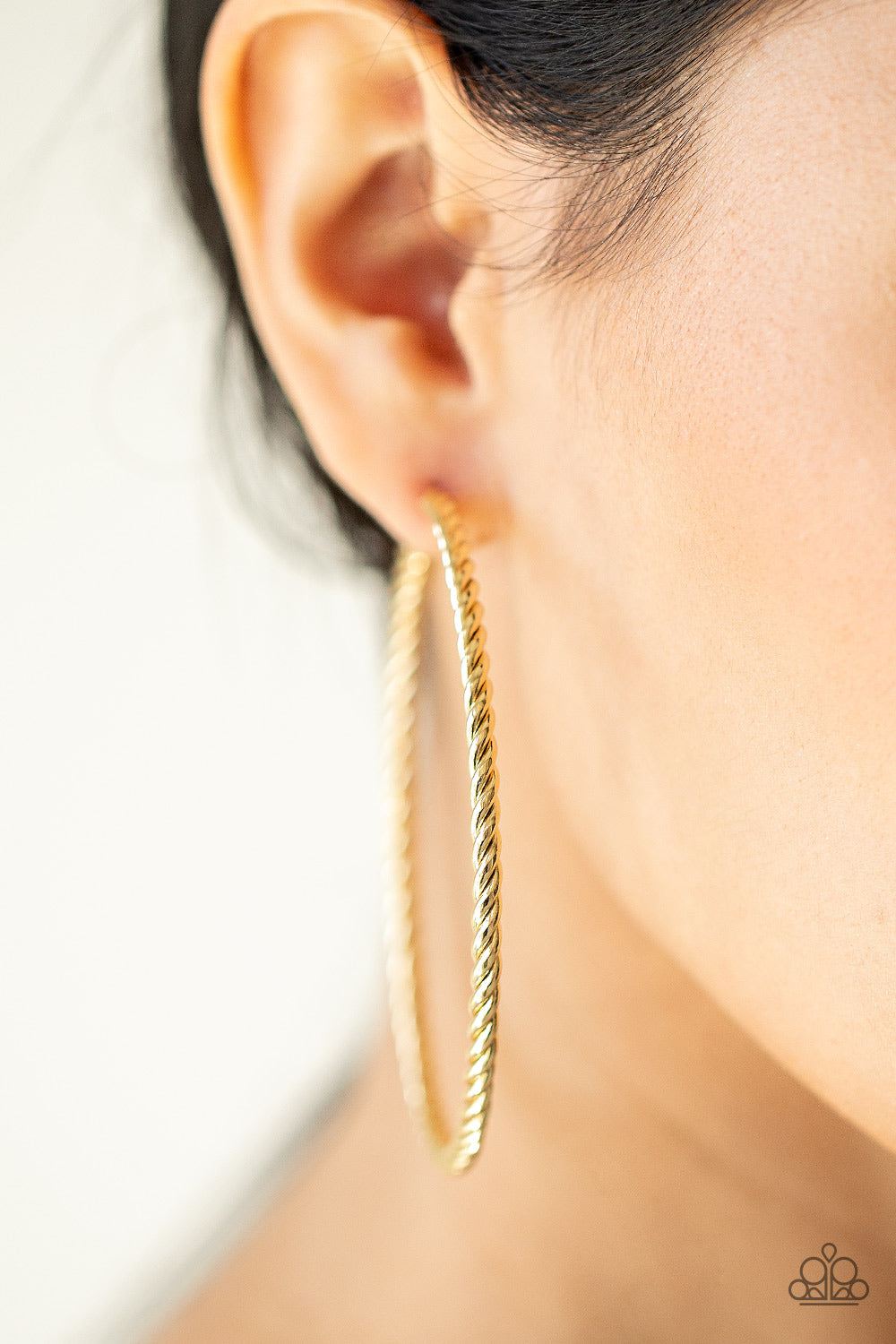 Paparazzi Accessories Resist The Twist - Gold Shiny gold strands twist together to form an edgy statement-making hoop. Earring attaches to a standard post fitting. Hoop measures approximately 2 3/4" in diameter. Sold as one pair of hoop earrings. Jewelry