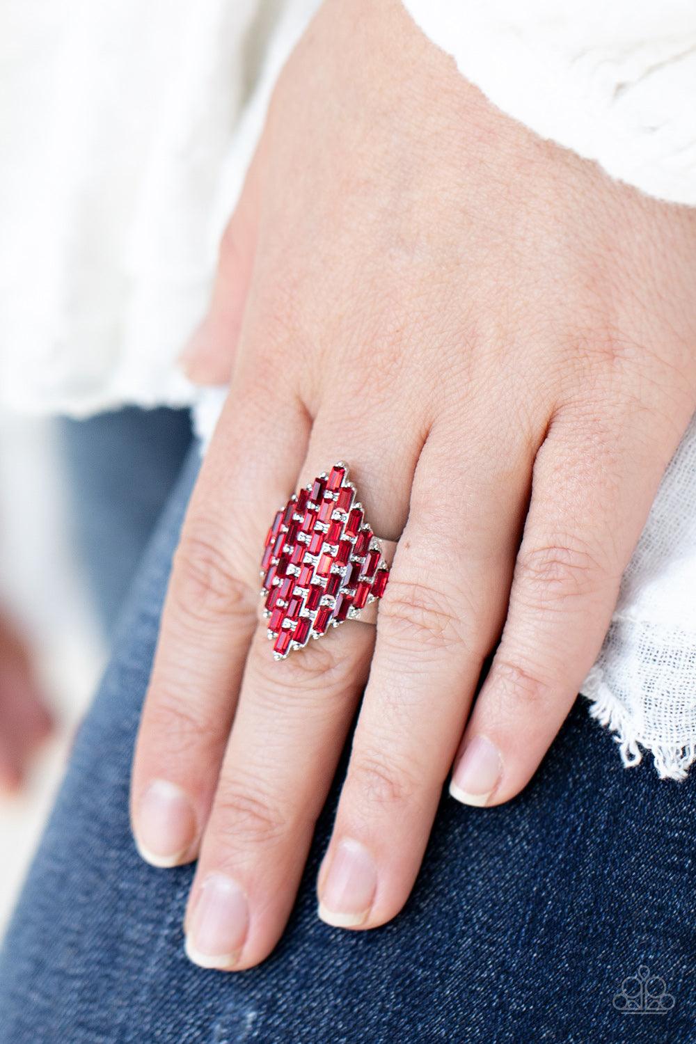Paparazzi Accessories Hive Hustle - Red Fiery red emerald cut rhinestones are encrusted across the front of a studded silver frame, creating a sparkly honeycomb shaped centerpiece. Features a stretchy band for a flexible fit. Sold as one individual ring.