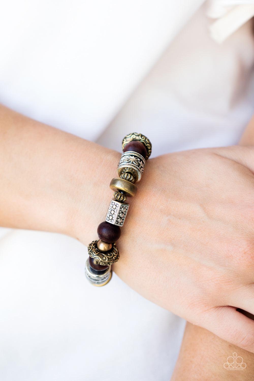 Paparazzi Accessories Exploring The Elements - Multi Stamped, studded, and embossed in tribal inspired patterns, a collection of chunky brass and silver beads join earthy wooden beads along a stretchy band around the wrist for an earthy flair. Sold as one
