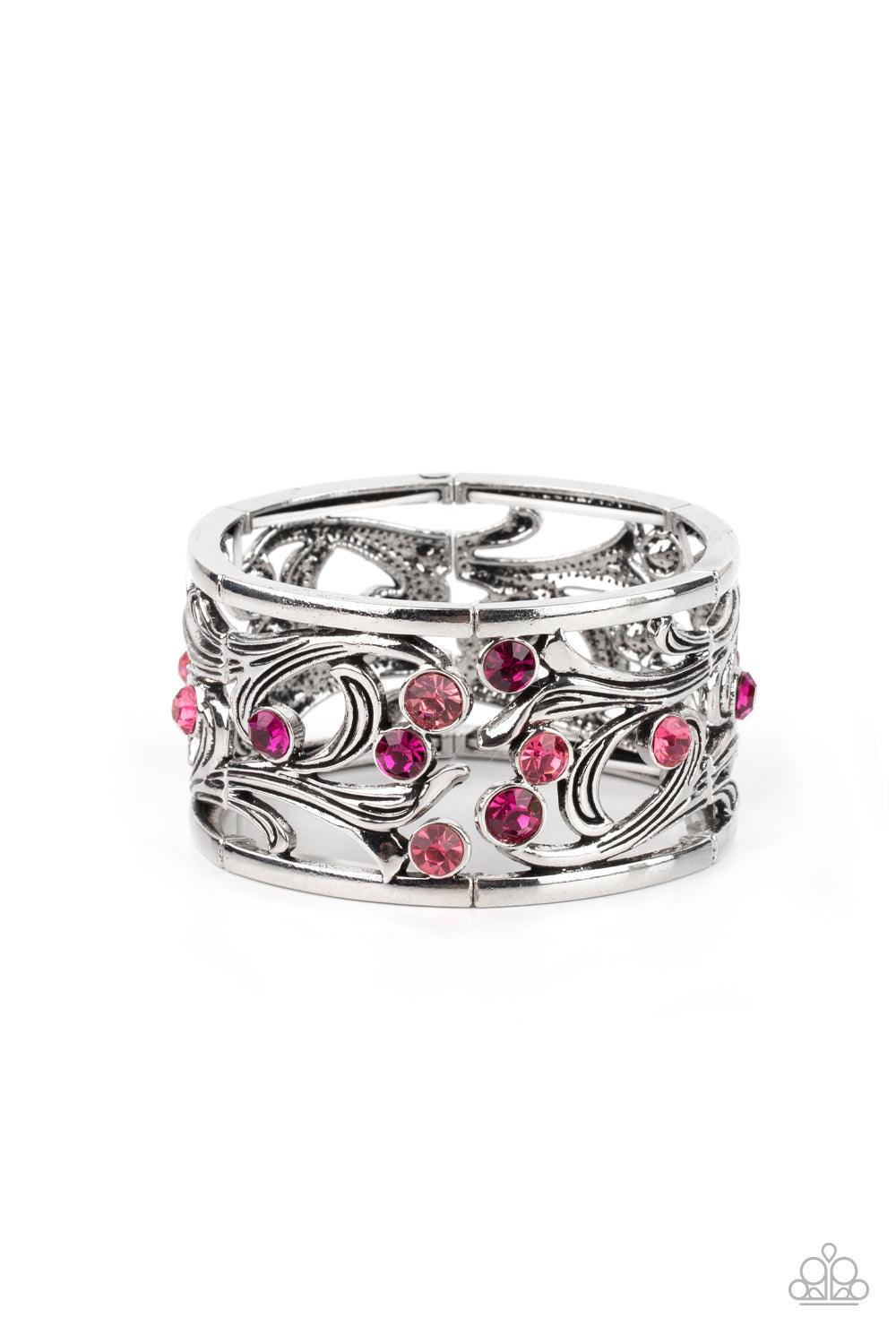 Paparazzi Accessories Garden Masquerade - Pink An ombre of pink rhinestones scatters across an airy floral frame among vine-like filigree. The romantically whimsical frames are threaded along stretchy bands and repeat around the wrist for an enchanting di