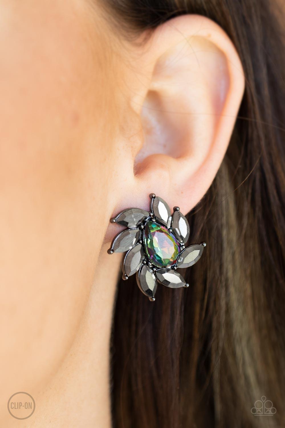 Paparazzi Accessories Sophisticated Swirl - Multi *Clip-On A faceted oil spill teardrop gem is encompassed by a radiating frame of sparkling hematite marquise rhinestones set in gunmetal pronged fittings creating a dramatically vintage finish. Earring att