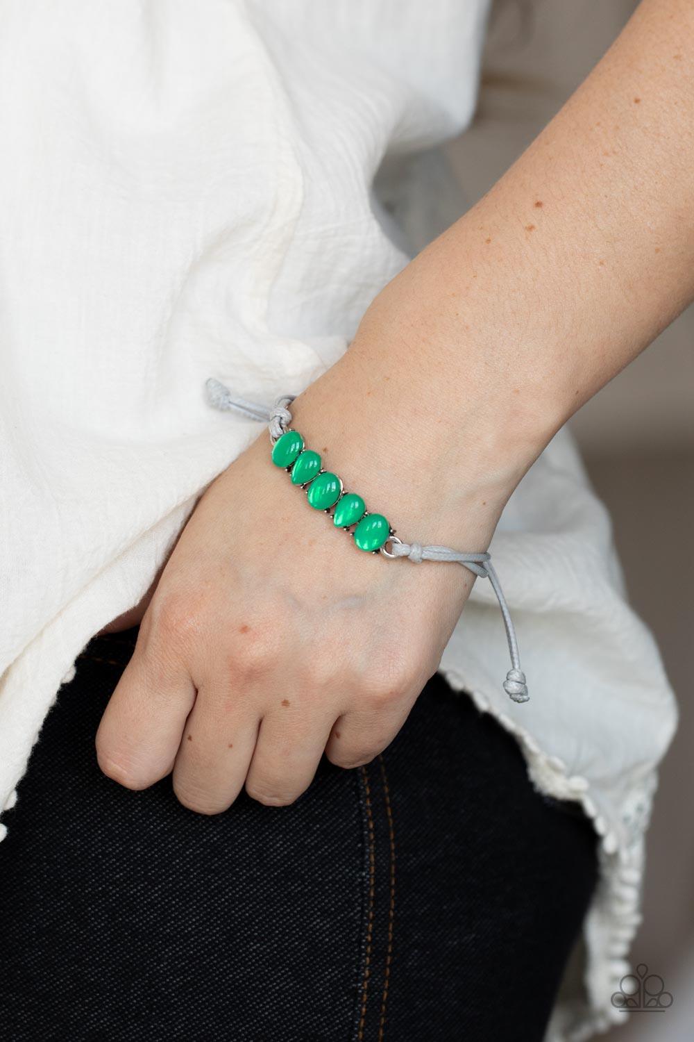 Paparazzi Accessories Opal Paradise - Green Featuring silver pronged fittings, a row of oval and teardrop opal Mint beads delicately connects into a solitaire frame. The ethereal centerpiece is knotted in place with rows of shiny gray cording, creating a