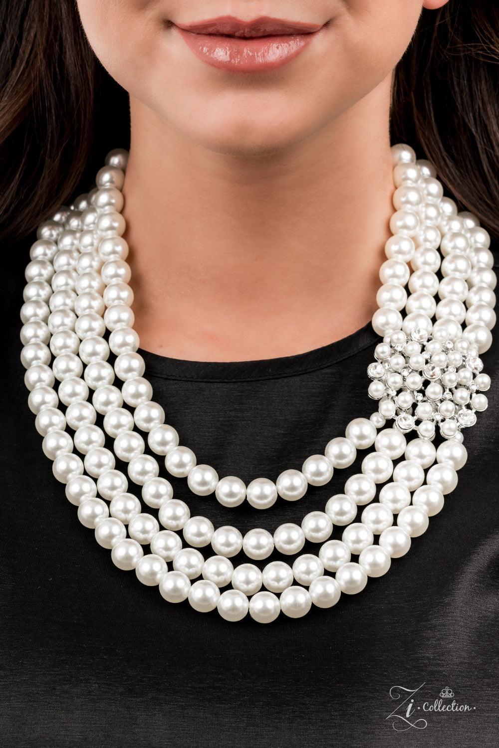 Paparazzi Accessories Romantic Inspired by royalty, an elegant explosion of classic white rhinestones and timeless pearls delicately coalesces into a vintage brooch. The refined ornament delicately holds together strands of oversized pearls, creating roma