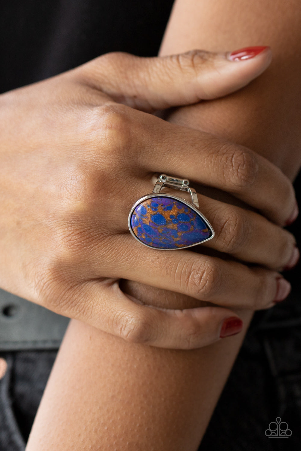 Paparazzi Accessories Stormy Sunrise - Purple A generous polished blue stone infused with veins of brown and purple is encased in a simple silver teardrop frame resulting in a seasonal finish atop the finger. Features a stretchy band for a flexible fit. S