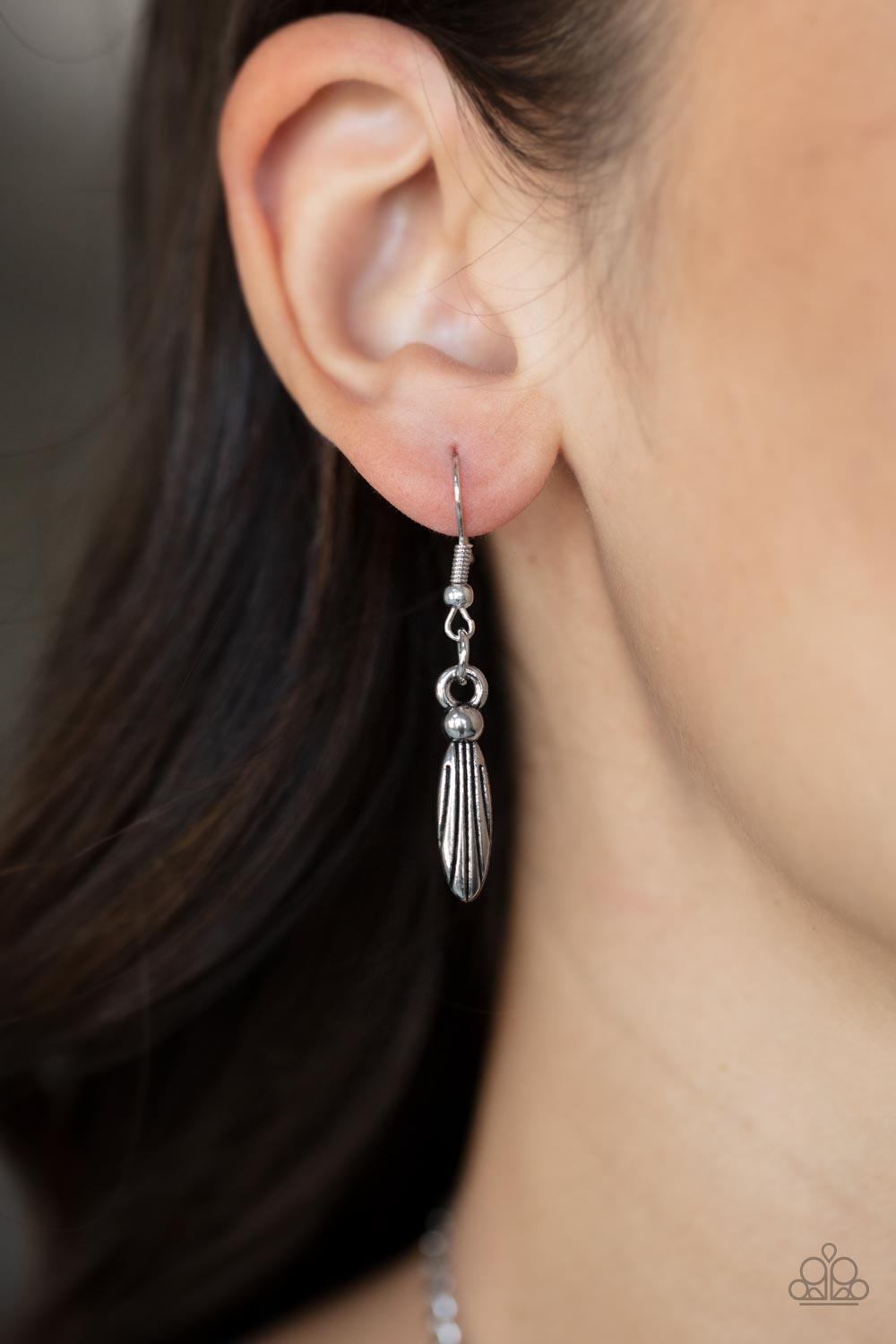 Paparazzi Accessories Lunar Enchantment - Pink Embossed in studded, geometric, and paisley filigree-like patterns, three mismatched silver half moon plates dramatically link below the collar. Featuring an entrancing pink UV shimmer, an oversized collectio