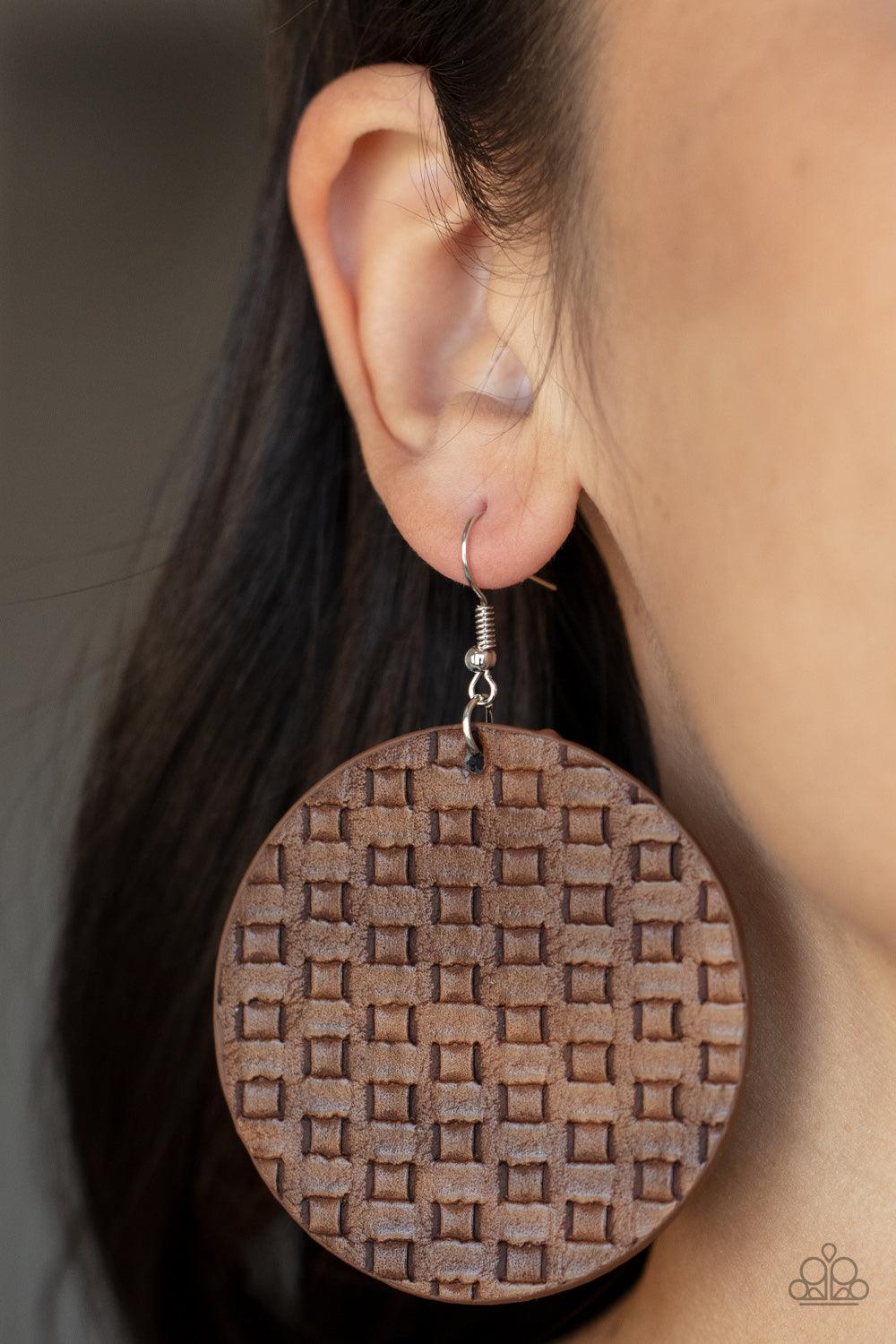 Paparazzi Accessories WEAVE Me Out Of It - Brown Featuring a faux woven pattern a leathery brown frame swings from the ear for an earthy artisan fashion. Earring attaches to a standard fishhook fitting. Sold as one pair of earrings. Jewelry