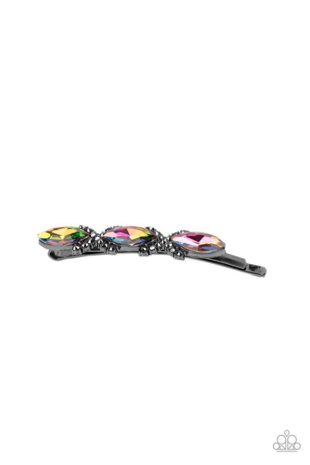 Paparazzi Accessories Stellar Socialite - Multi Crisscrossed ribbons of smoky hematite rhinestones separate a trio of oil spill marquise cut gems across the front of a classic gunmetal bobby pin for a stellar fashion. Sold as one individual decorative bob