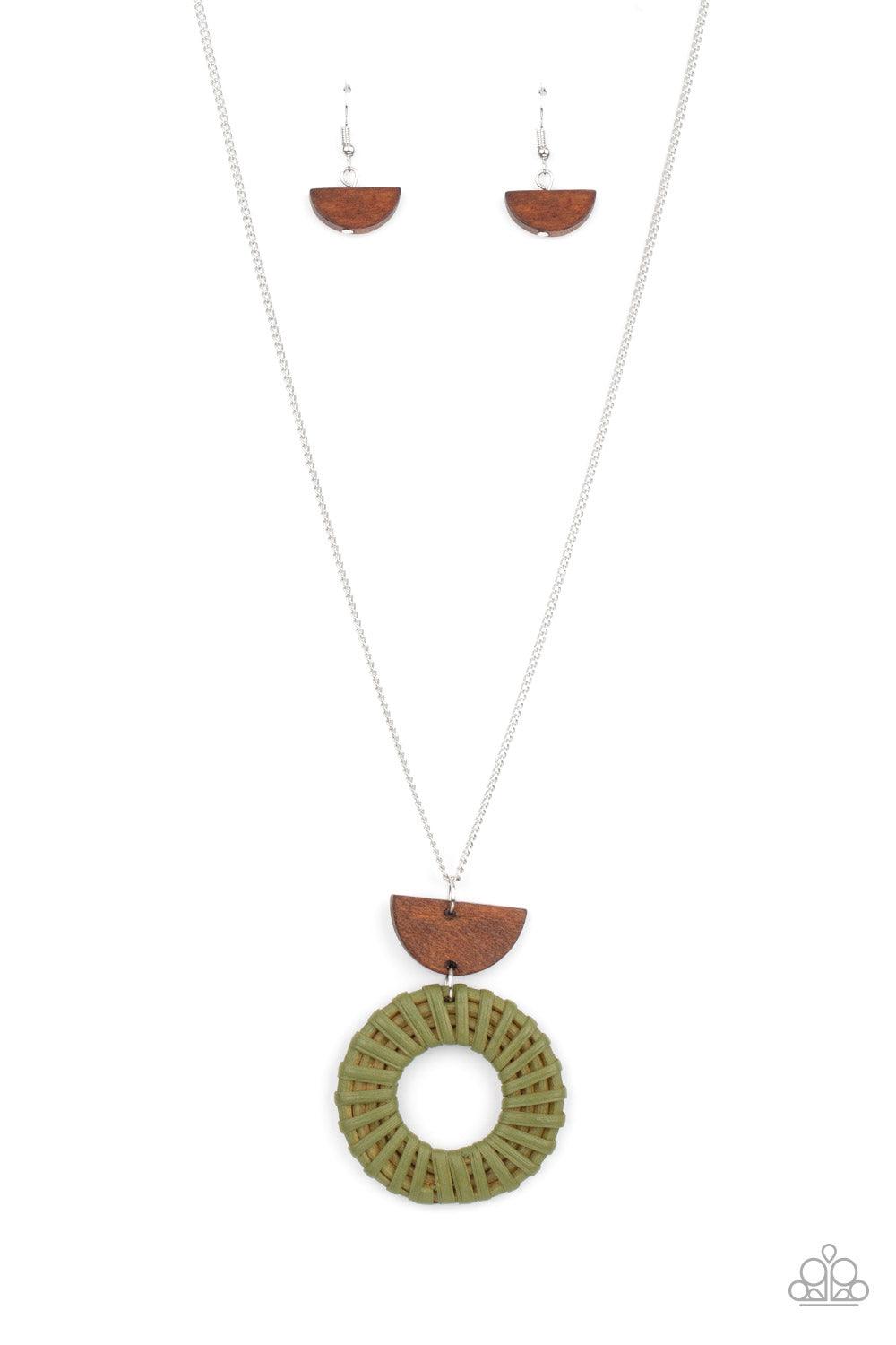 Paparazzi Accessories Homespun Stylist - Green Green wicker-like cording wraps into a rustic hoop at the bottom of a half-moon wooden frame. The earthy stacked pendants swing from a lengthened silver chain, creating an artisan-inspired display. Features a