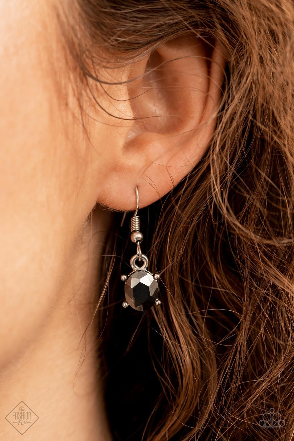 Paparazzi Accessories Modern Day Marvel - Silver Anchored by a glassy oval hematite gem, a mismatched collection of lustrous hematite, smoky, and black rhinestones in various modern shapes and sizes link together across the collar. The gritty display give