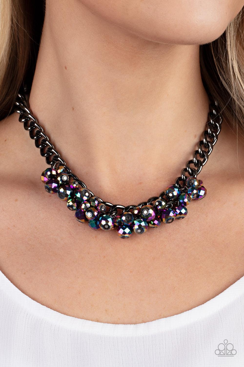 Paparazzi Accessories Galactic Knockout - Multi Flecked in oil spill iridescence, a faceted collection of metallic beads cluster along the center of a chunky gunmetal curb chain, creating a stellar fringe below the collar. Features an adjustable clasp clo