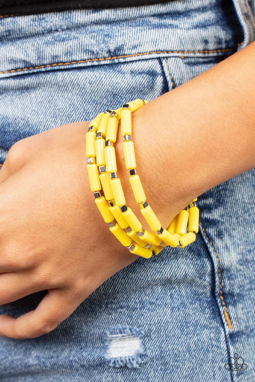 Paparazzi Accessories Radiantly Retro - Yellow A playful collection of dainty silver cube beads and cylindrical Illuminating beads are threaded along stretchy bands, creating colorful layers around the wrist. Sold as one set of four bracelets. Jewelry