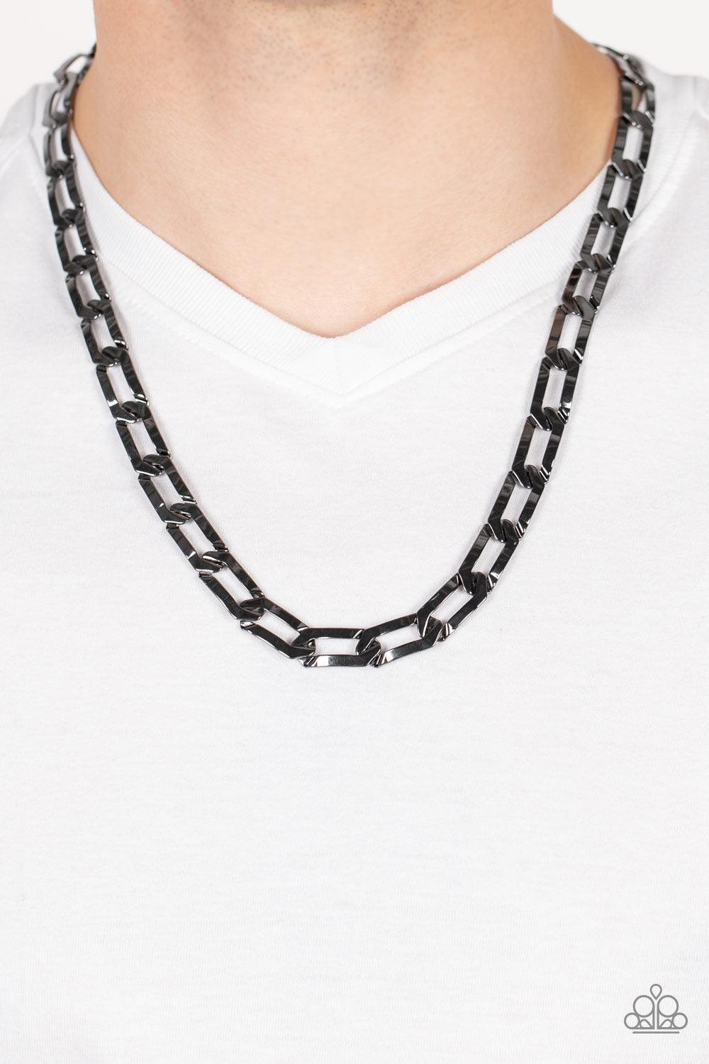 Paparazzi Accessories Full-Court Press - Black Crimped gunmetal oval links boldly interconnect across the chest, creating a classic urban look. Features an adjustable clasp closure. Sold as one individual necklace. Jewelry