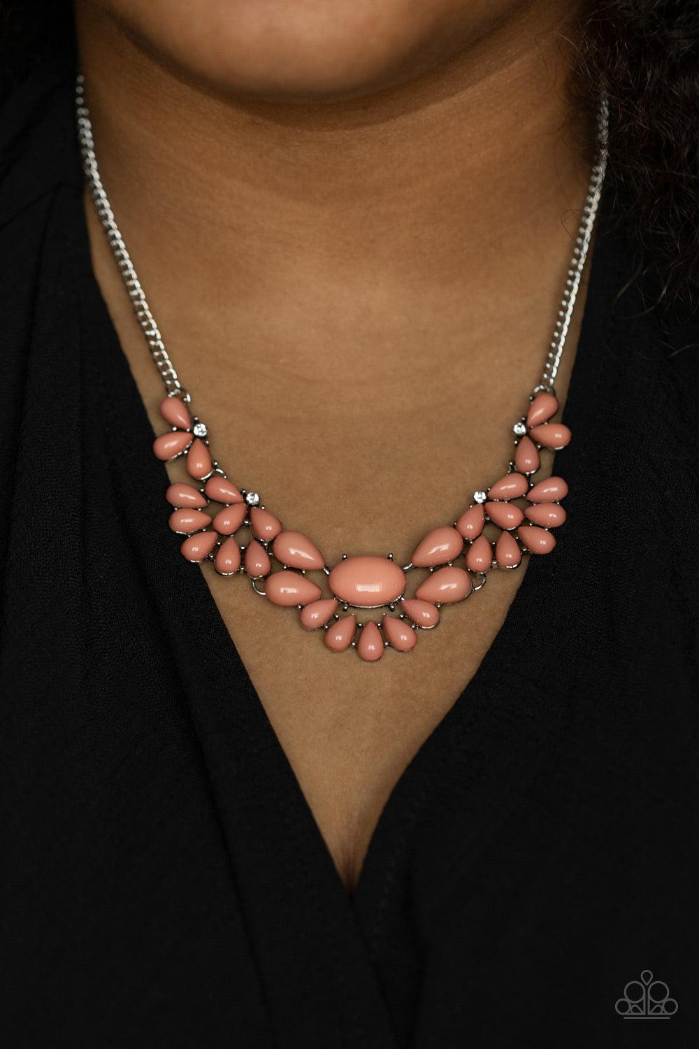 Paparazzi Accessories Secret GARDENISTA - Pink Teardrop Pale Rosette beads fan out from the bottoms of solitaire white rhinestones as they link below the collar, creating whimsically stacked frames. Featuring an oval center, oversized teardrop beads flare