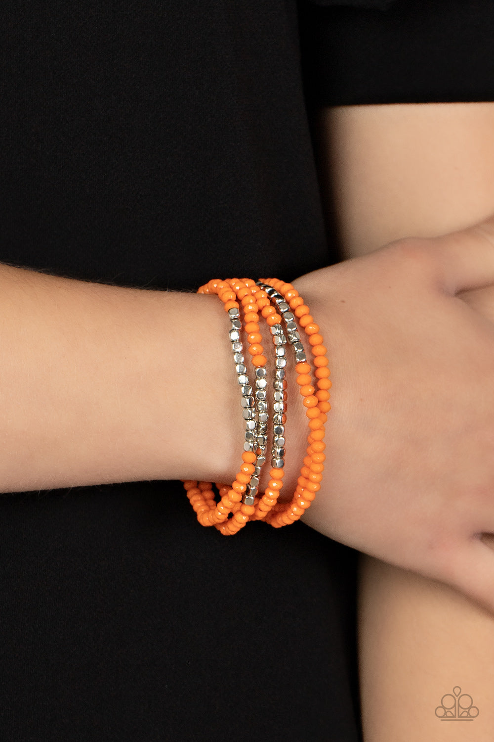 Paparazzi Accessories Tulum Trek - Orange Infused with sections of shiny silver cube beads, a flamboyant collection of faceted orange beads are threaded along stretchy bands around the wrist for a vivacious pop of color. Sold as one set of five bracelets.