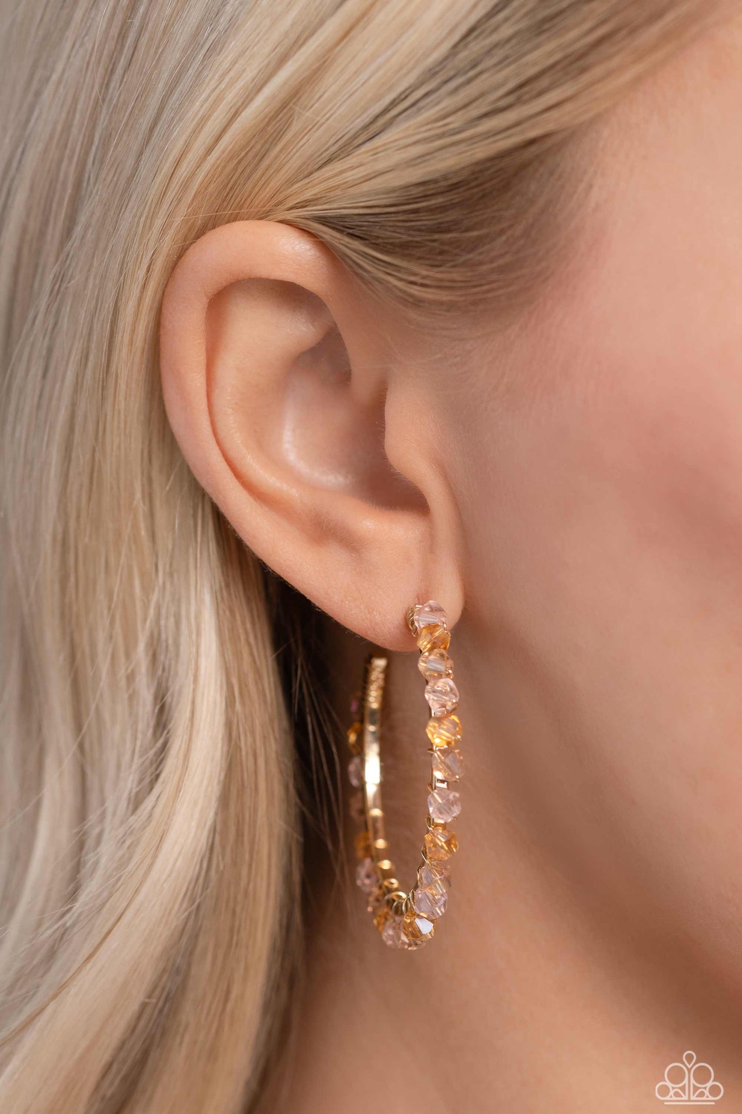 Paparazzi Accessories Halo Hustle - Pink Threaded along a dainty gold wire, an iridescent collection of pink, golden, and champagne colored crystal-like beads wrap around the front of a classic gold hoop for an unexpected pop of shimmer. Hoop measures app