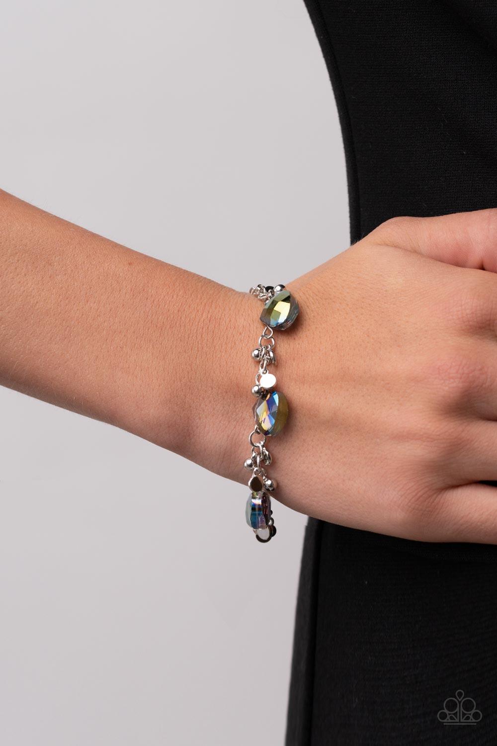 Paparazzi Accessories Super Nova Nouveau - Multi Dainty clusters of silver beads and silver discs connect with metallic multi gems around the wrist, resulting in a stellar fringe. Features an adjustable clasp closure. Sold as one individual bracelet. Brac