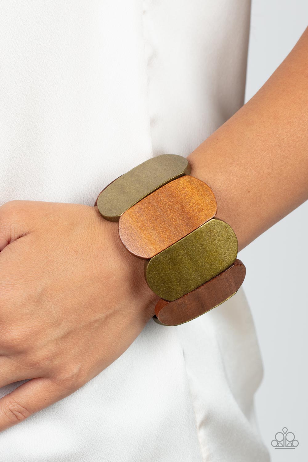 Paparazzi Accessories Natural Nirvana - Brass Brushed in a brassy shimmer, smooth wooden panels alternate with natural wood panels threaded along stretchy bands for a naturally balanced display around the wrist. Sold as one individual bracelet. Jewelry