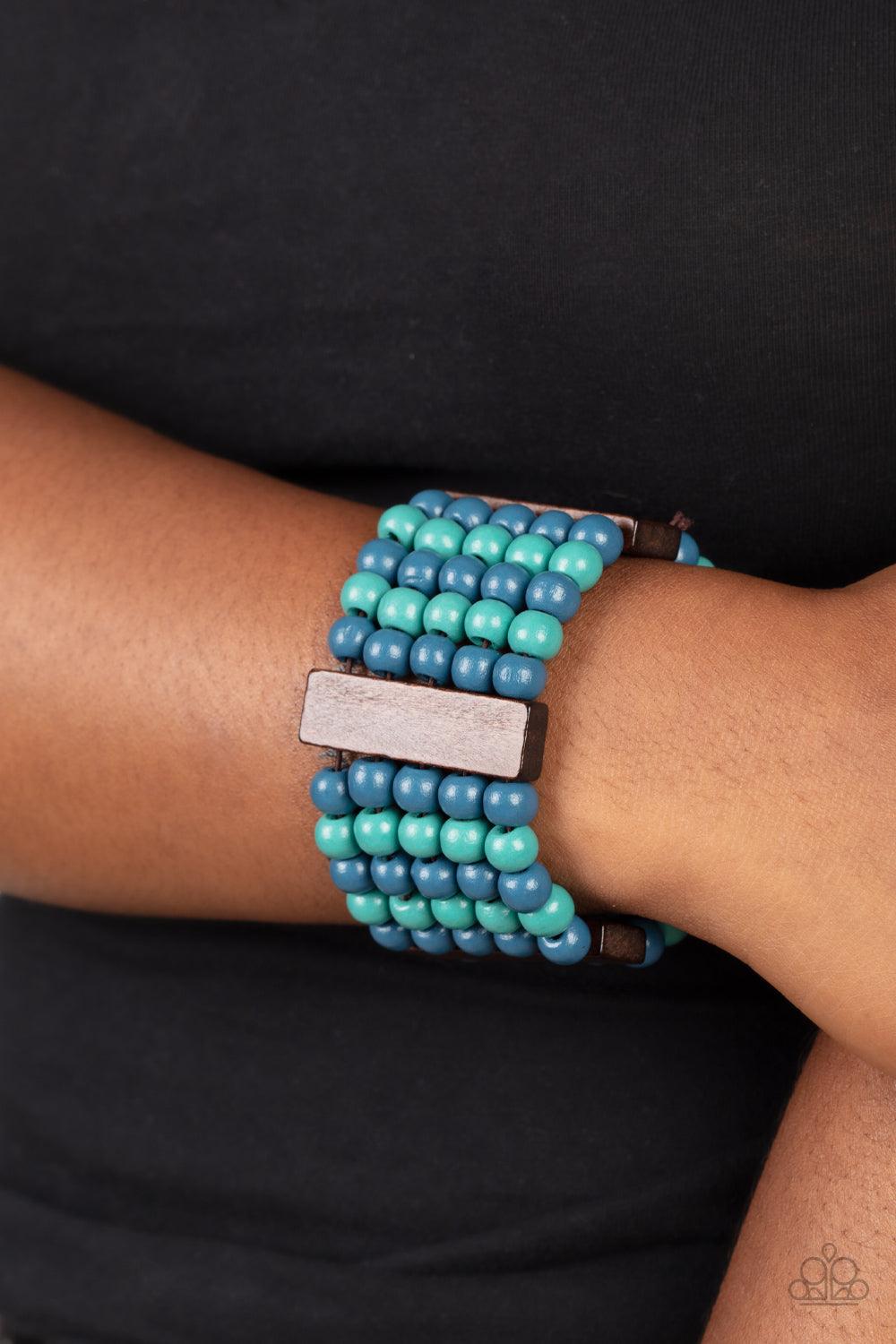Paparazzi Accessories Island Soul - Blue Colorful layers of blue and turquoise wooden beads are threaded along stretchy bands between dark brown wooden bars creating stacks of subtle bliss around the wrist. Sold as one individual bracelet. Jewelry