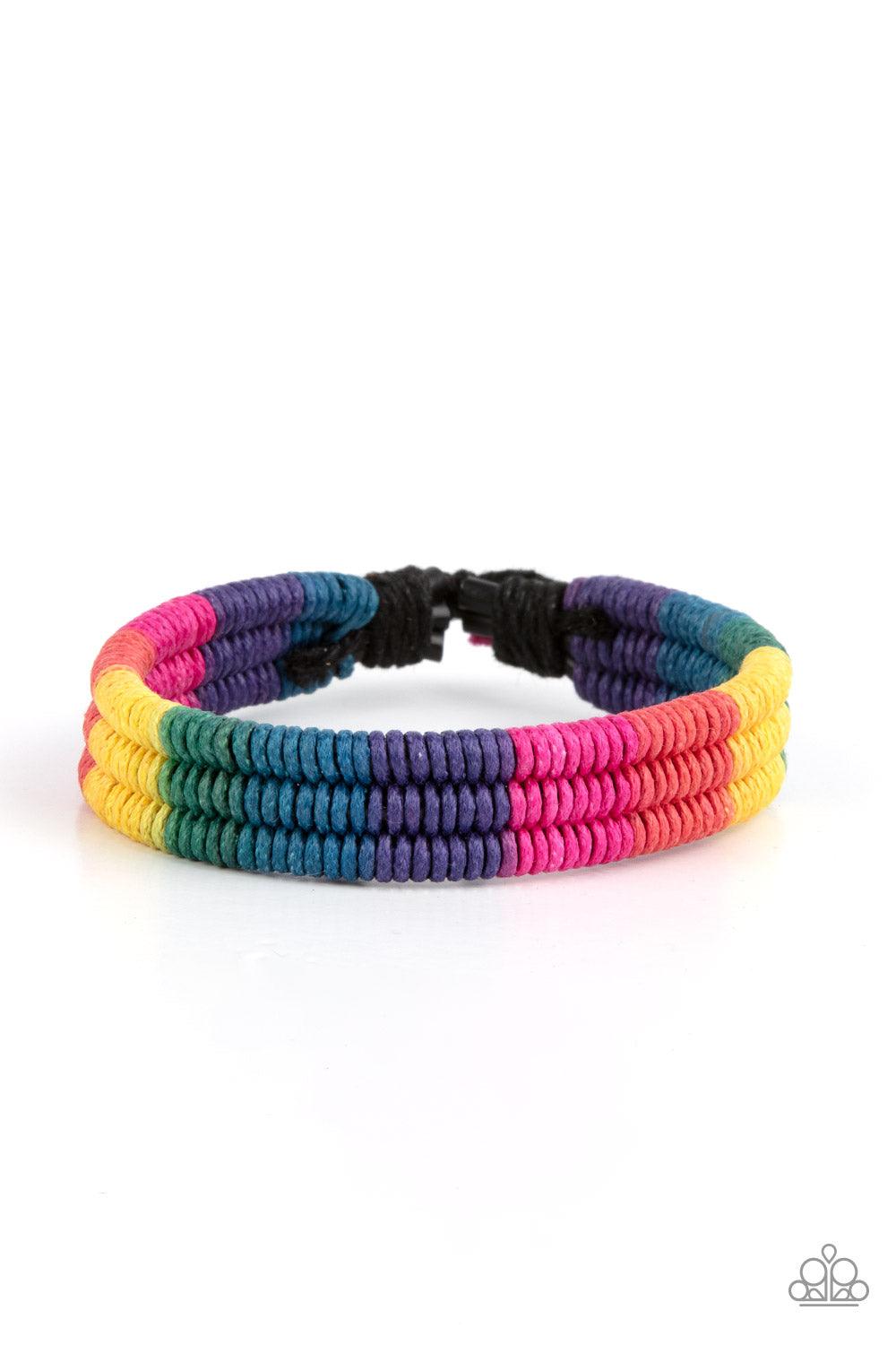 Paparazzi Accessories Rainbow Renegade - Multi Colorful sections of pink, red, yellow, green, blue, and purple cords ornately wrap and weave around three black bands, coalescing into a radiant rainbow around the wrist. Features an adjustable sliding knot
