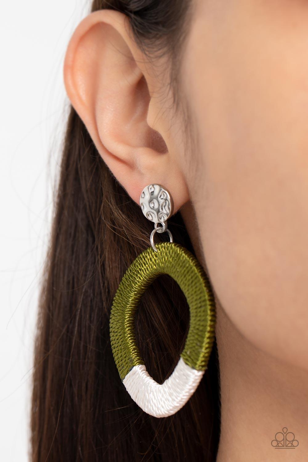 Paparazzi Accessories Thats a WRAPAROUND - Green A hammered silver disc gives way to a wooden frame decoratively wrapped in shiny white and Olive Branch threaded accents, creating a colorful lure. Earring attaches to a standard post fitting. Sold as one p