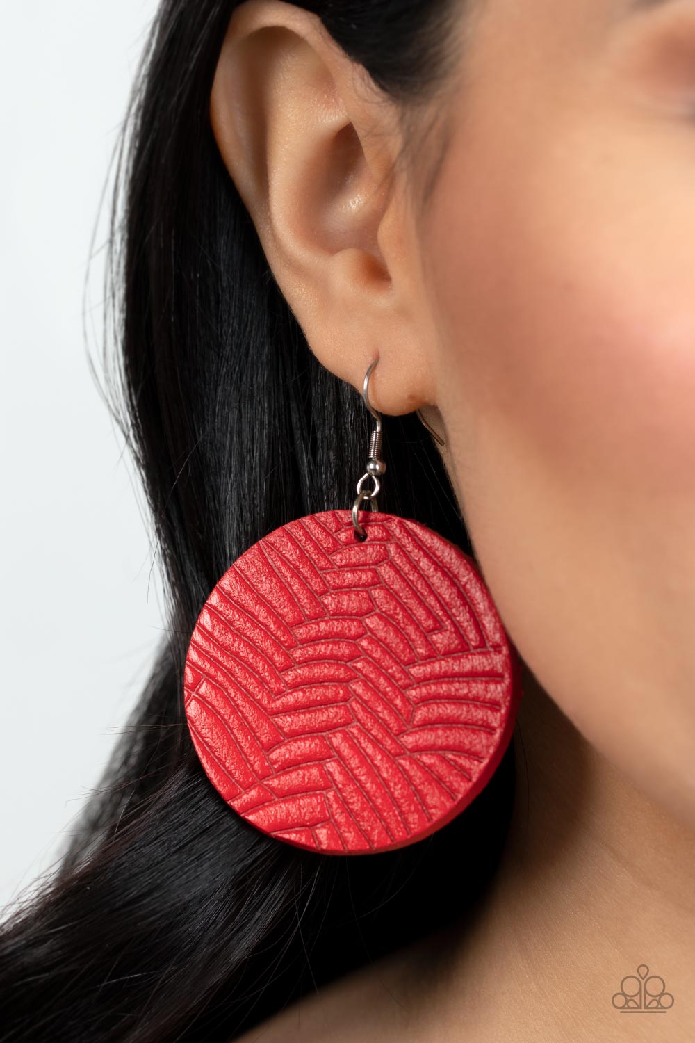 Paparazzi Accessories Leathery Loungewear - Red Etched in layers of geometric detail, a Fire Whirl leather disc swings from the ear for an authentically earthy look. Earring attaches to a standard fishhook fitting. Sold as one pair of earrings. Jewelry