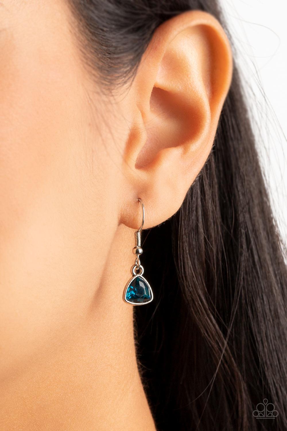 Paparazzi Accessories Galactic Duchess - Blue A faceted asymmetrical blue gem is encased in a sleek silver frame at the bottom of a silver popcorn chain, creating a stellar pendant below the collar. Features an adjustable clasp closure. Sold as one indivi