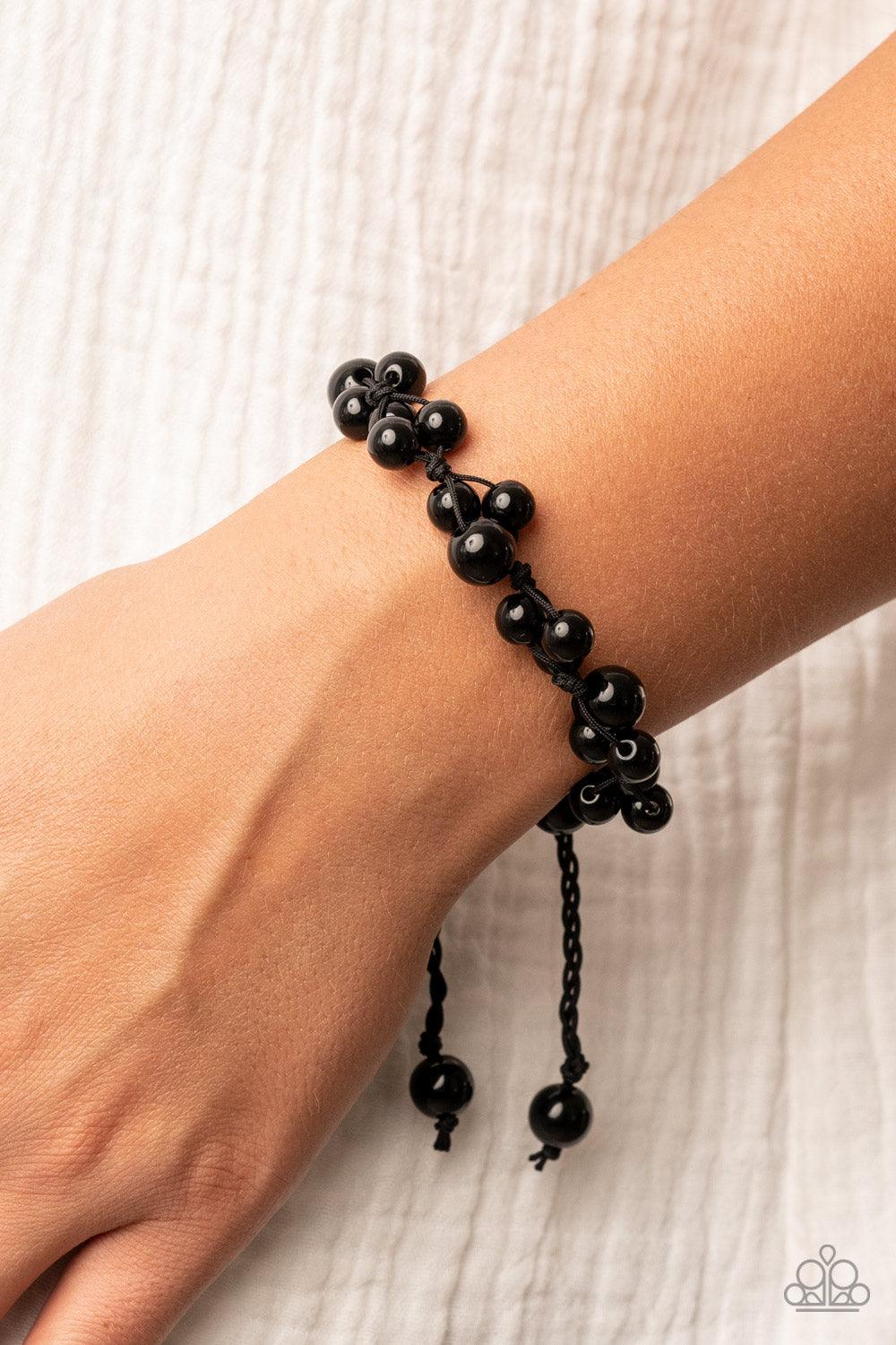 Paparazzi Accessories Vintage Versatility - Black Bubbly clusters of black beads are decoratively knotted around the wrist, adding a timeless twist to the classic centerpiece. Features an adjustable sliding knot closure. Sold as one individual bracelet. J