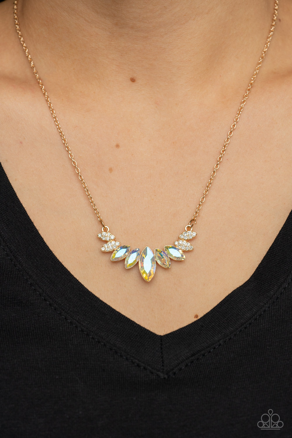 Paparazzi Accessories One Empire at a Time - Gold A fan of iridescent marquise cut rhinestones is flanked by pairs of white rhinestone encrusted gold frames at the bottom of a dainty gold chain, resulting in a regal centerpiece below the collar. Features