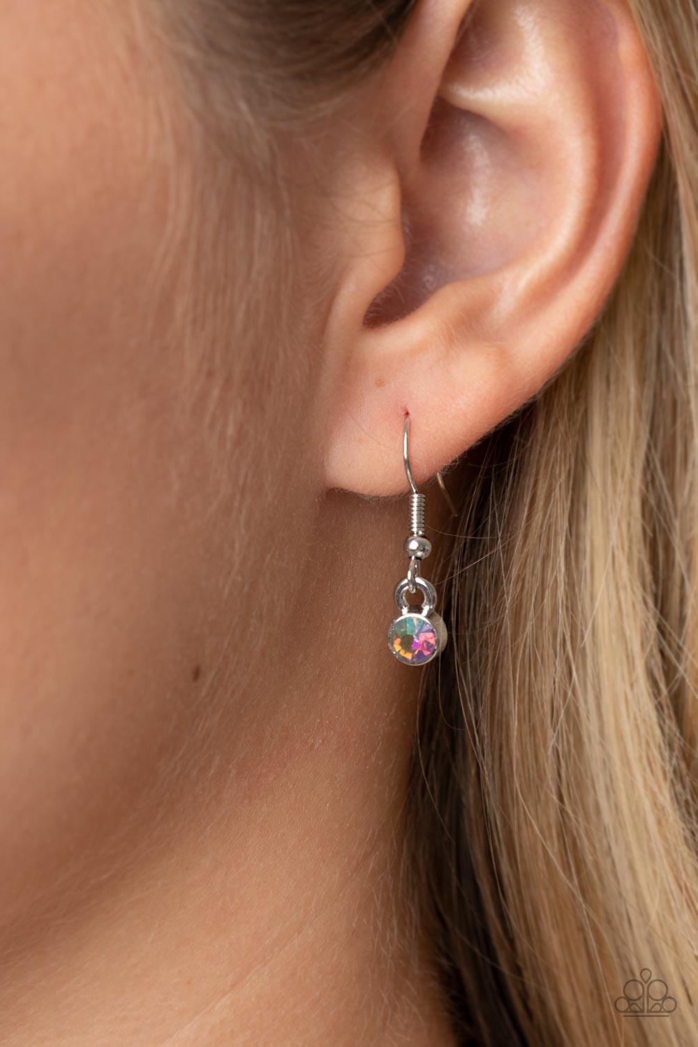 Paparazzi Accessories Cosmic Constellations - Multi Encased in sleek silver fittings, an oversized collection of UV geometric gems gradually increase in size as they link below the collar for a stellar statement. Features an adjustable clasp closure. Due