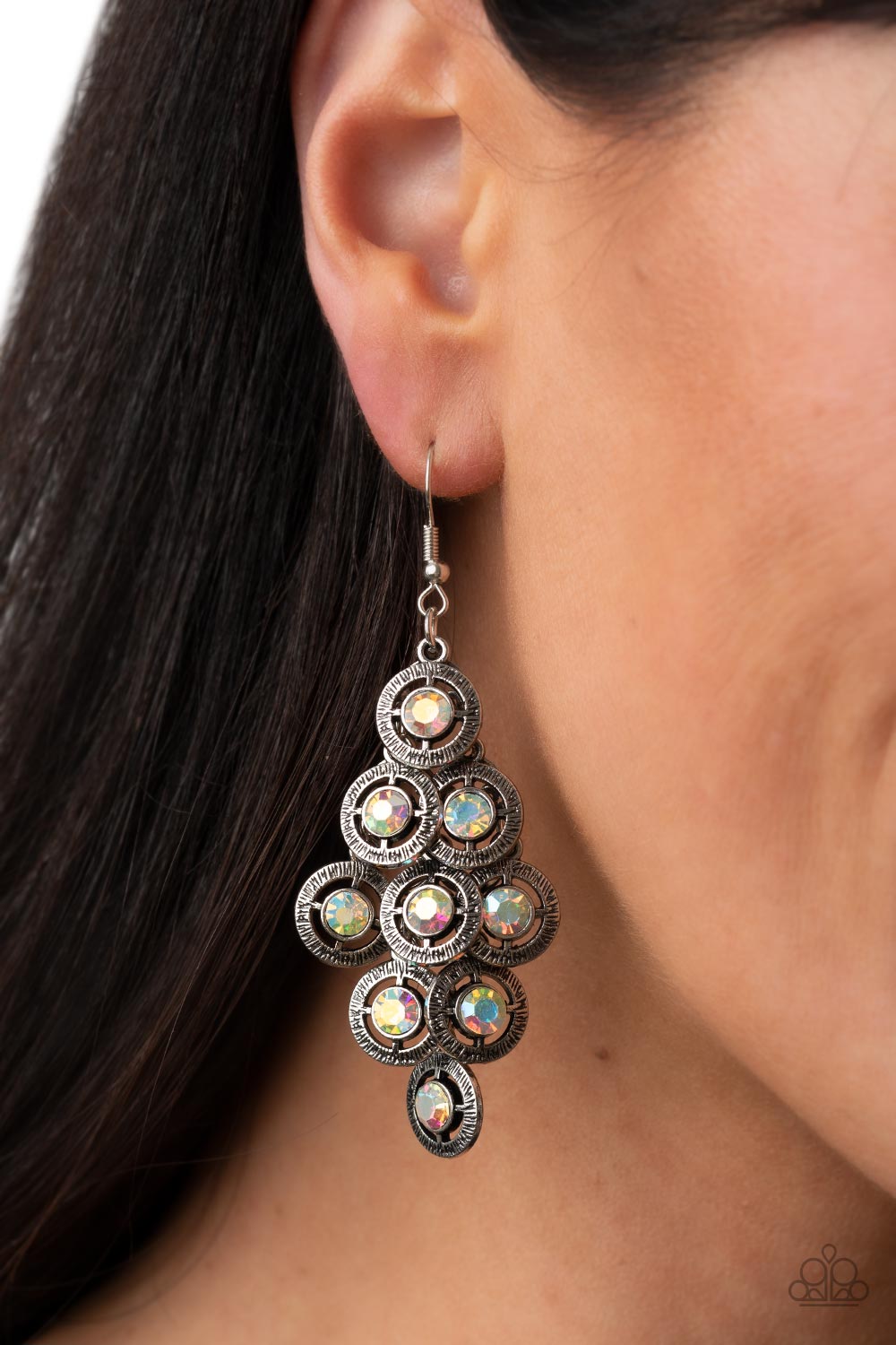 Paparazzi Accessories Constellation Cruise - Multi Dotted with iridescent rhinestone centers, tiers of textured silver frames cascade from a metallic backdrop for a stellar tasseled look. Earring attaches to a standard fishhook fitting. Sold as one pair o