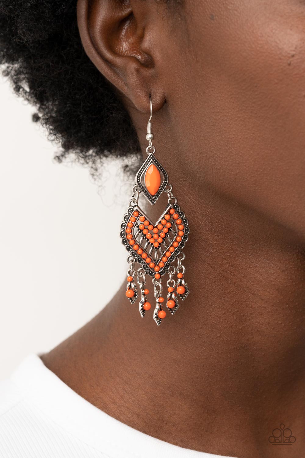 Paparazzi Accessories Dearly Debonair - Orange Featuring the refreshing hue of Burnt Orange, dainty seed beads adorn the front of a scalloped heart shaped frame that swings from the bottom of a studded silver frame adorned in a marquise cut Burnt Orange b
