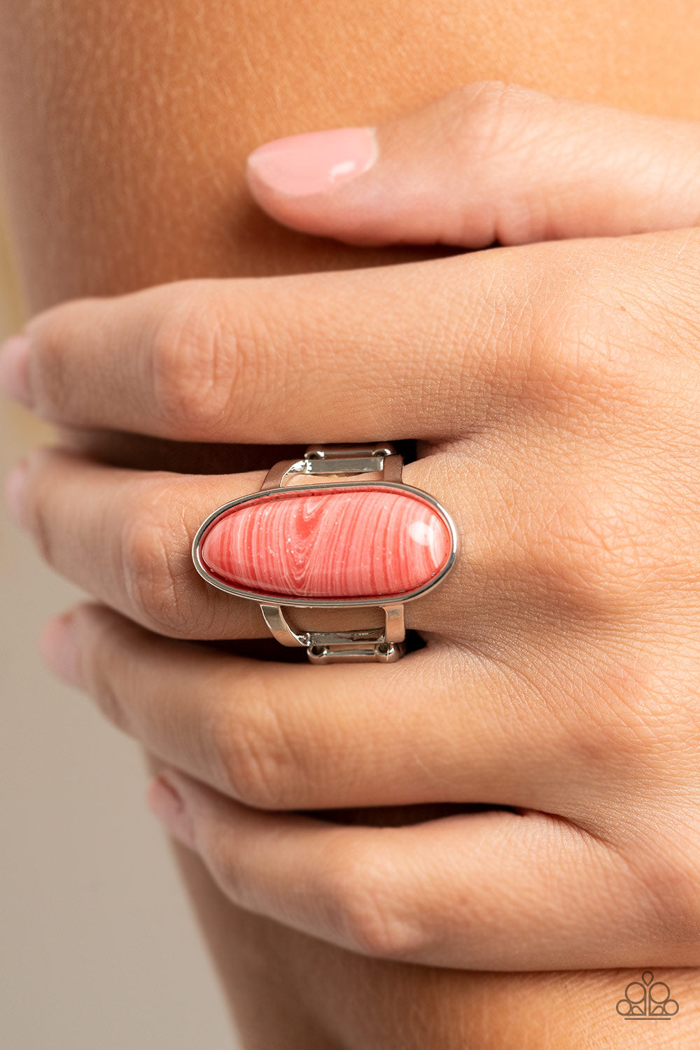 Paparazzi Accessories Eco Expression - Pink Painted in a faux sandstone finish, an oblong pink bead is pressed into a sleek silver fitting atop layered silver bands for an artisanal finish. Features a stretchy band for a flexible fit. Sold as one individu