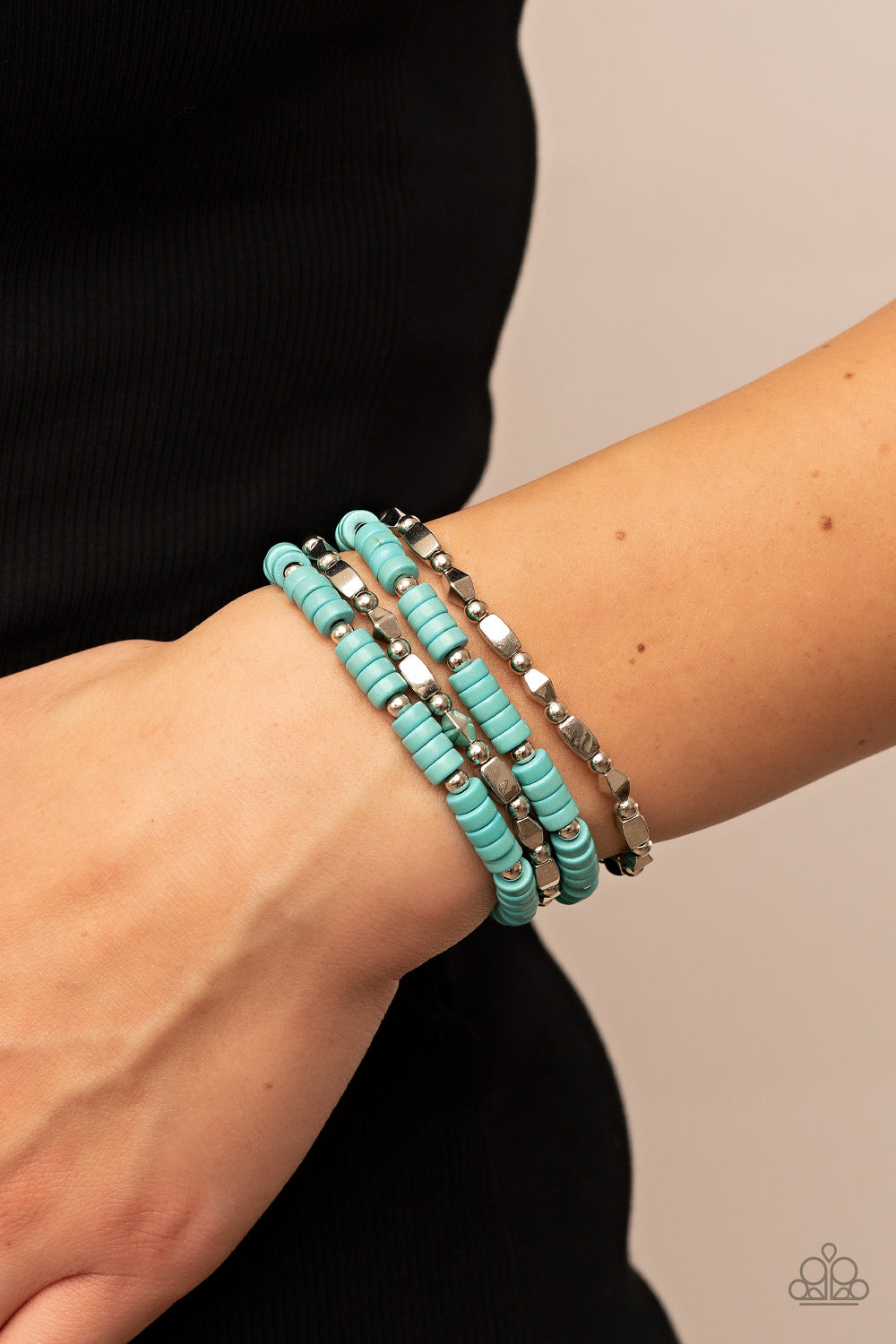 Paparazzi Accessories Anasazi Apothecary - Blue A mismatched assortment of dainty silver beads, turquoise stone discs, and faceted silver accents are threaded along stretchy bands, creating earthy layers around the wrist. Sold as one set of four bracelets